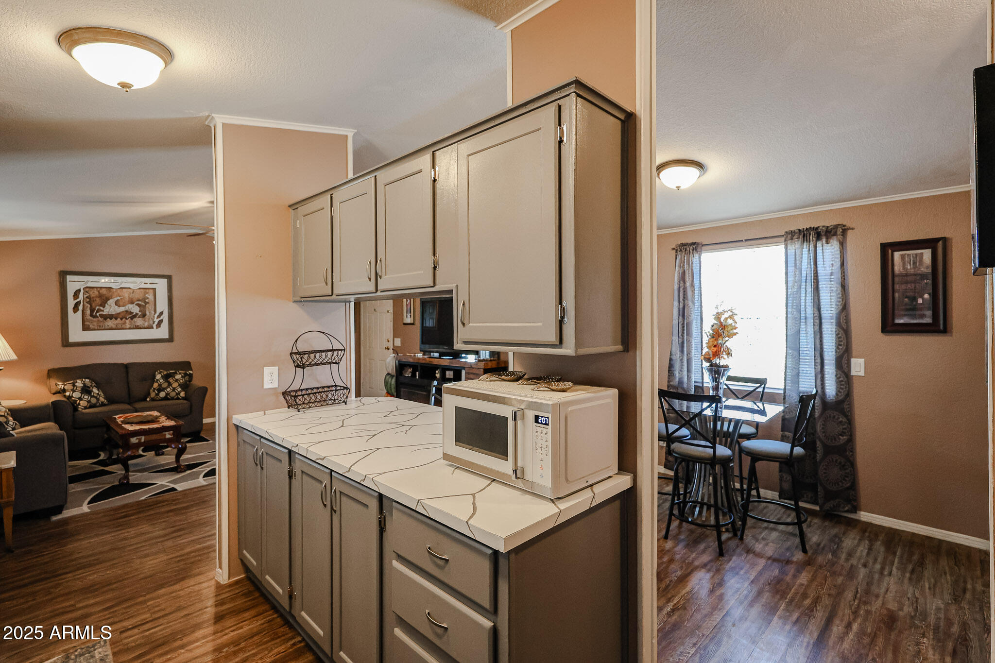 19602 North 32nd Street, Unit 32 Phoenix, AZ 85050 - Photo 13 of 37 a kitchen with a stove cabinets and wooden floor
