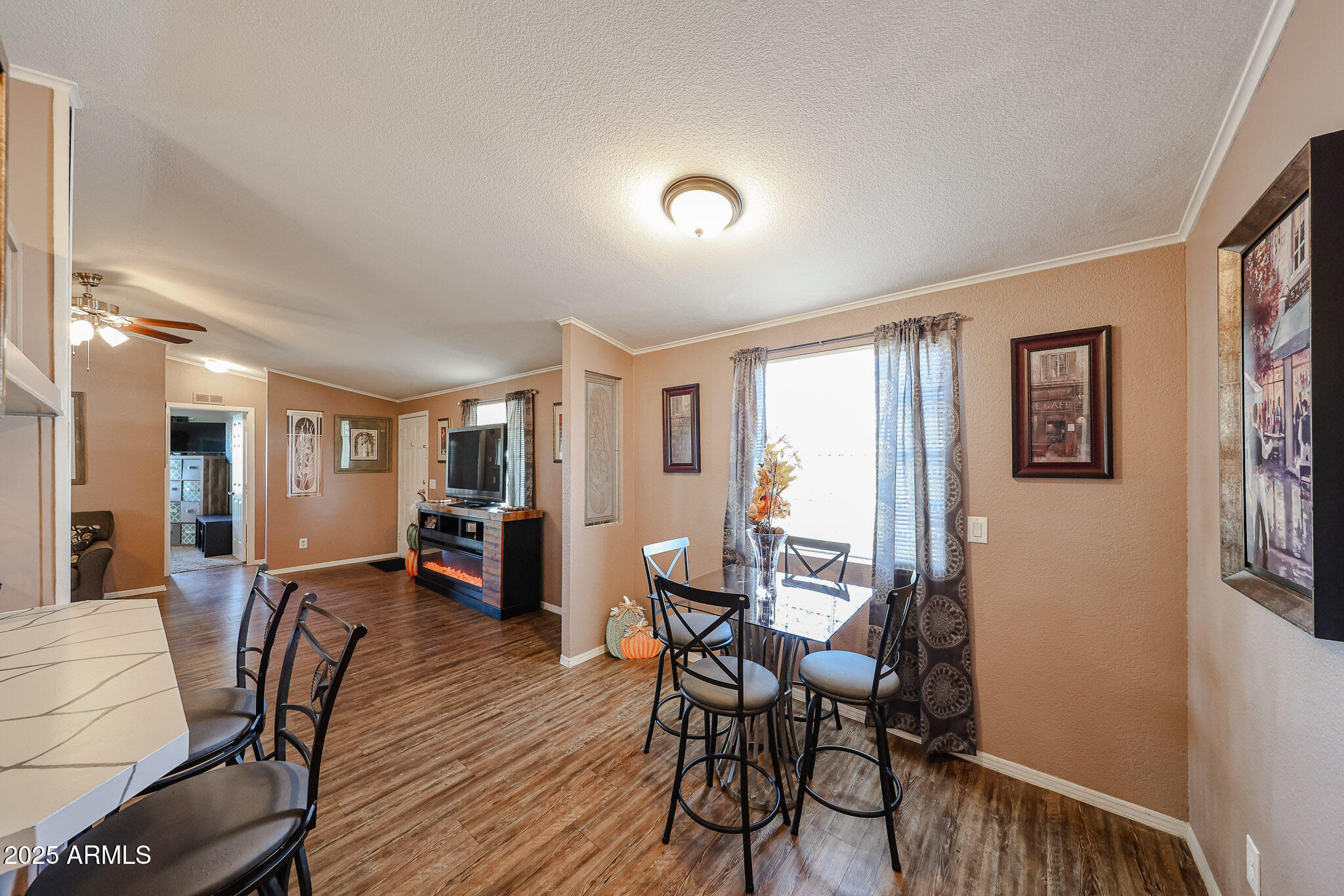 19602 North 32nd Street, Unit 32 Phoenix, AZ 85050 - Photo 14 of 37 a view of a dining room with furniture window and wooden floor