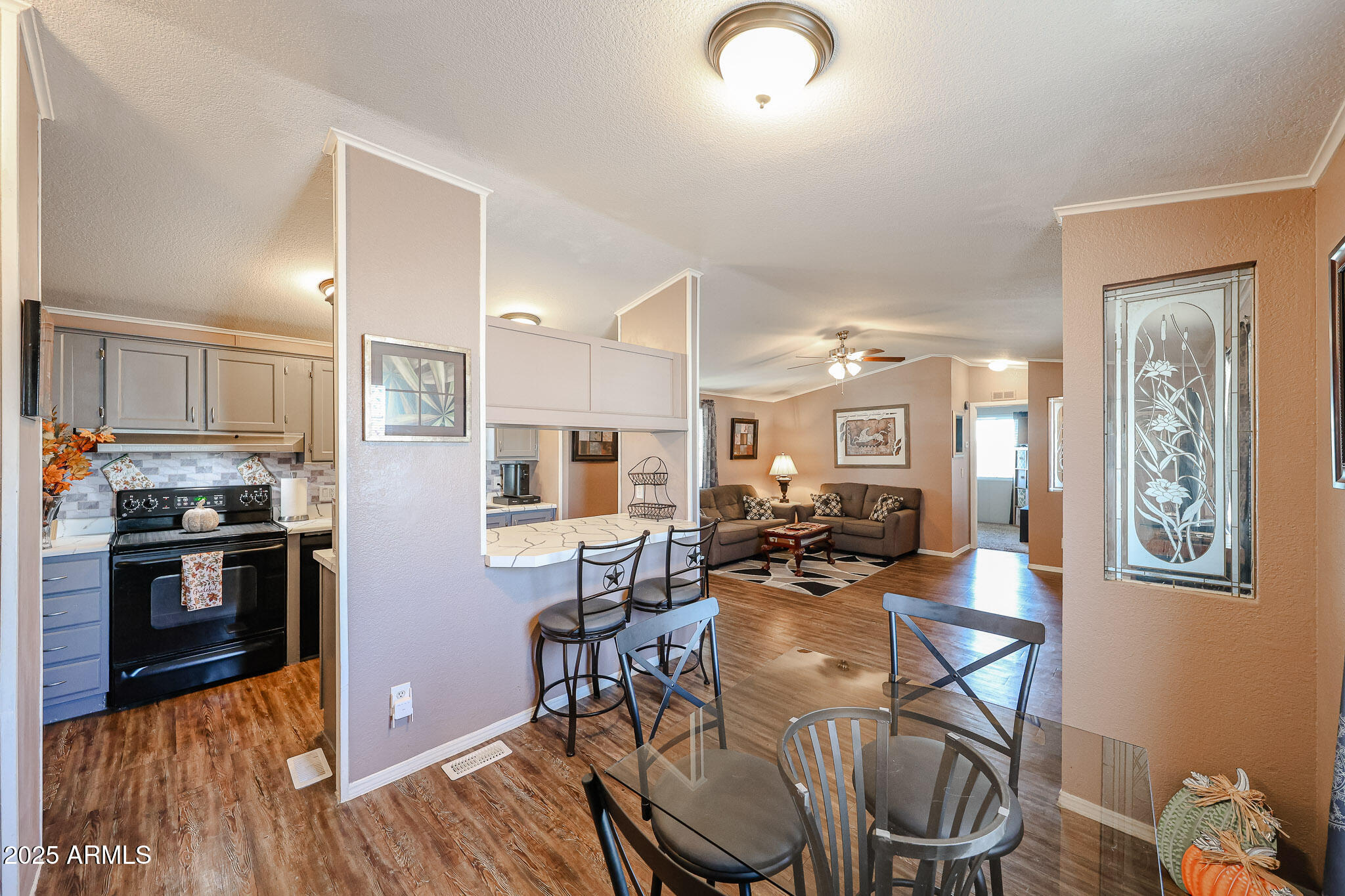 19602 North 32nd Street, Unit 32 Phoenix, AZ 85050 - Photo 15 of 37 a view of a dining room with furniture kitchen and wooden floor