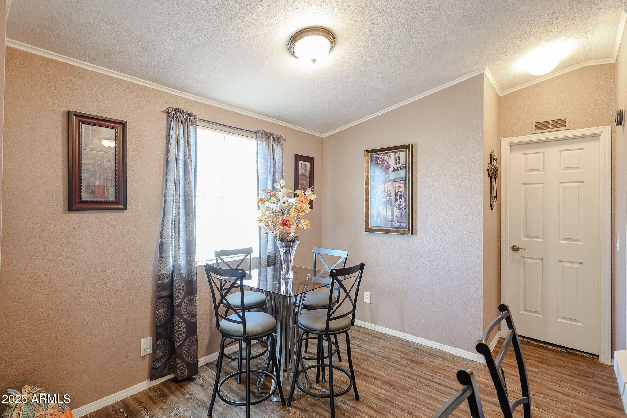 19602 North 32nd Street, Unit 32 Phoenix, AZ 85050 - Photo 17 of 37 a view of a dining room with furniture and wooden floor