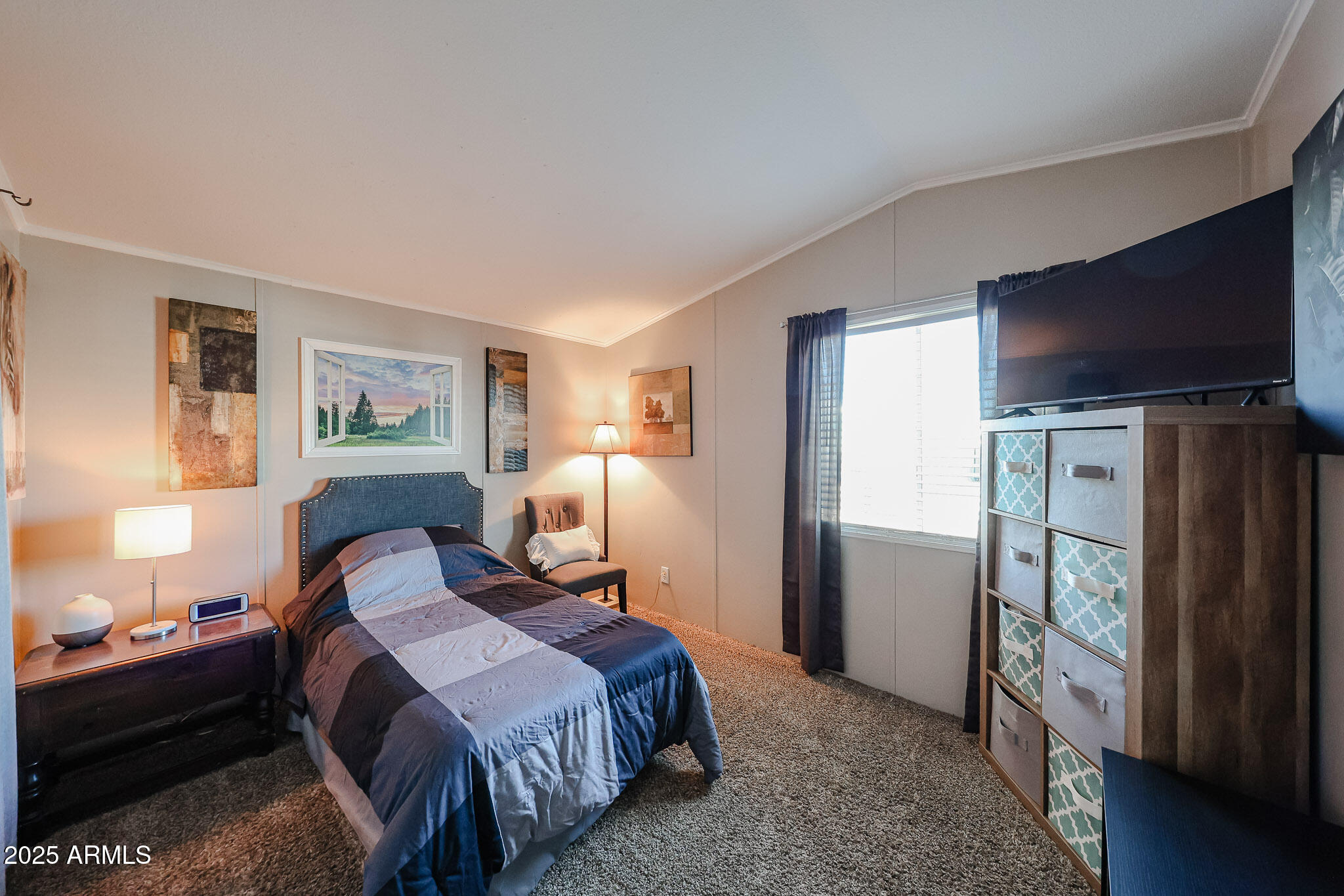 19602 North 32nd Street, Unit 32 Phoenix, AZ 85050 - Photo 24 of 37 a bedroom with a bed and a flat screen tv