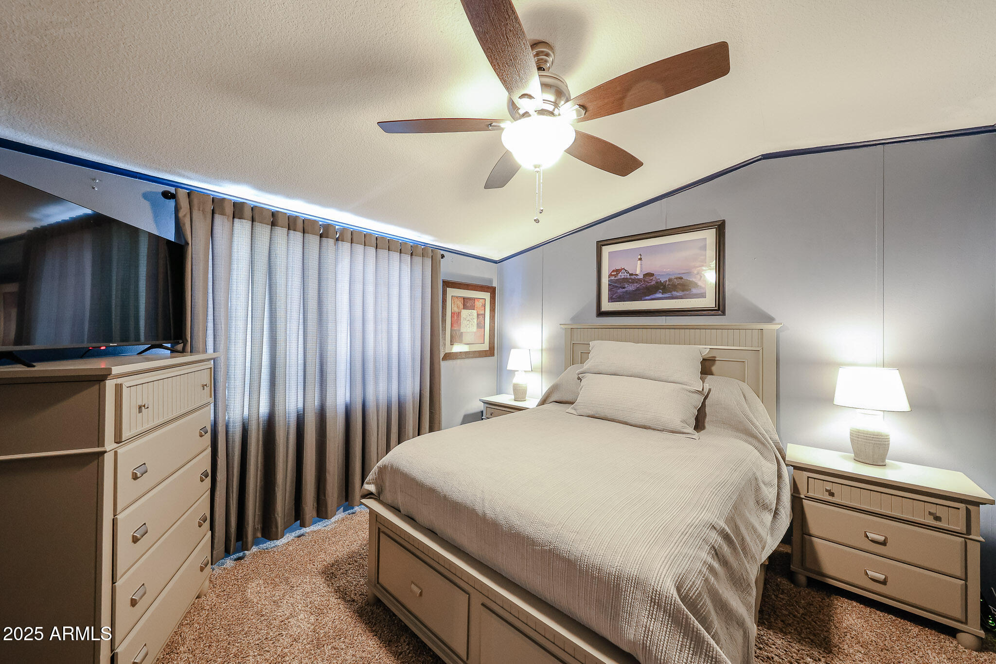 19602 North 32nd Street, Unit 32 Phoenix, AZ 85050 - Photo 29 of 37 a bedroom with a bed and a flat screen tv