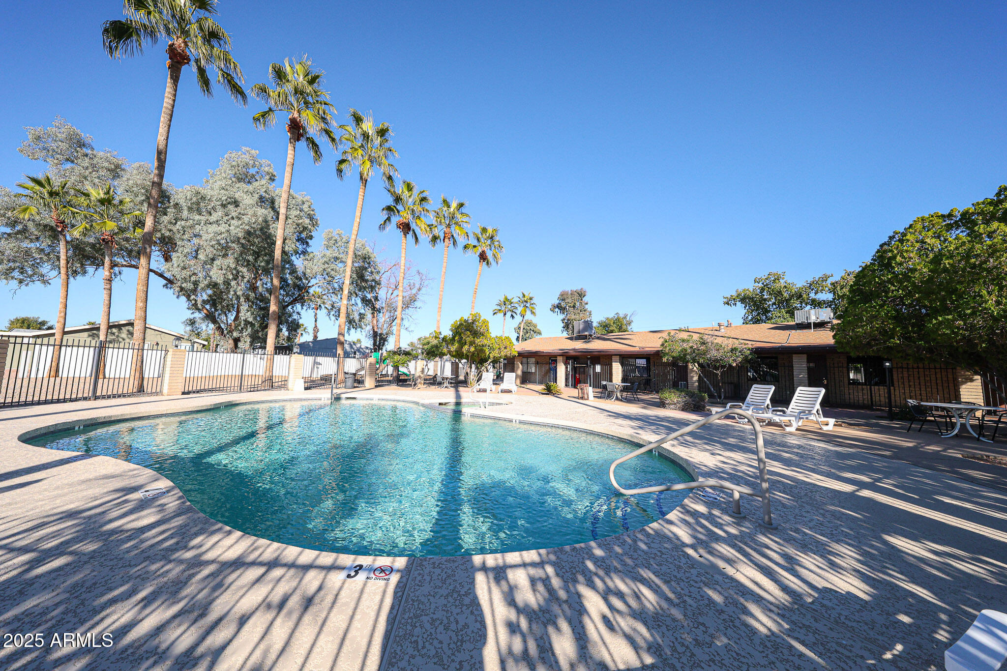 19602 North 32nd Street, Unit 32 Phoenix, AZ 85050 - Photo 35 of 37 a view of a swimming pool with an outdoor seating