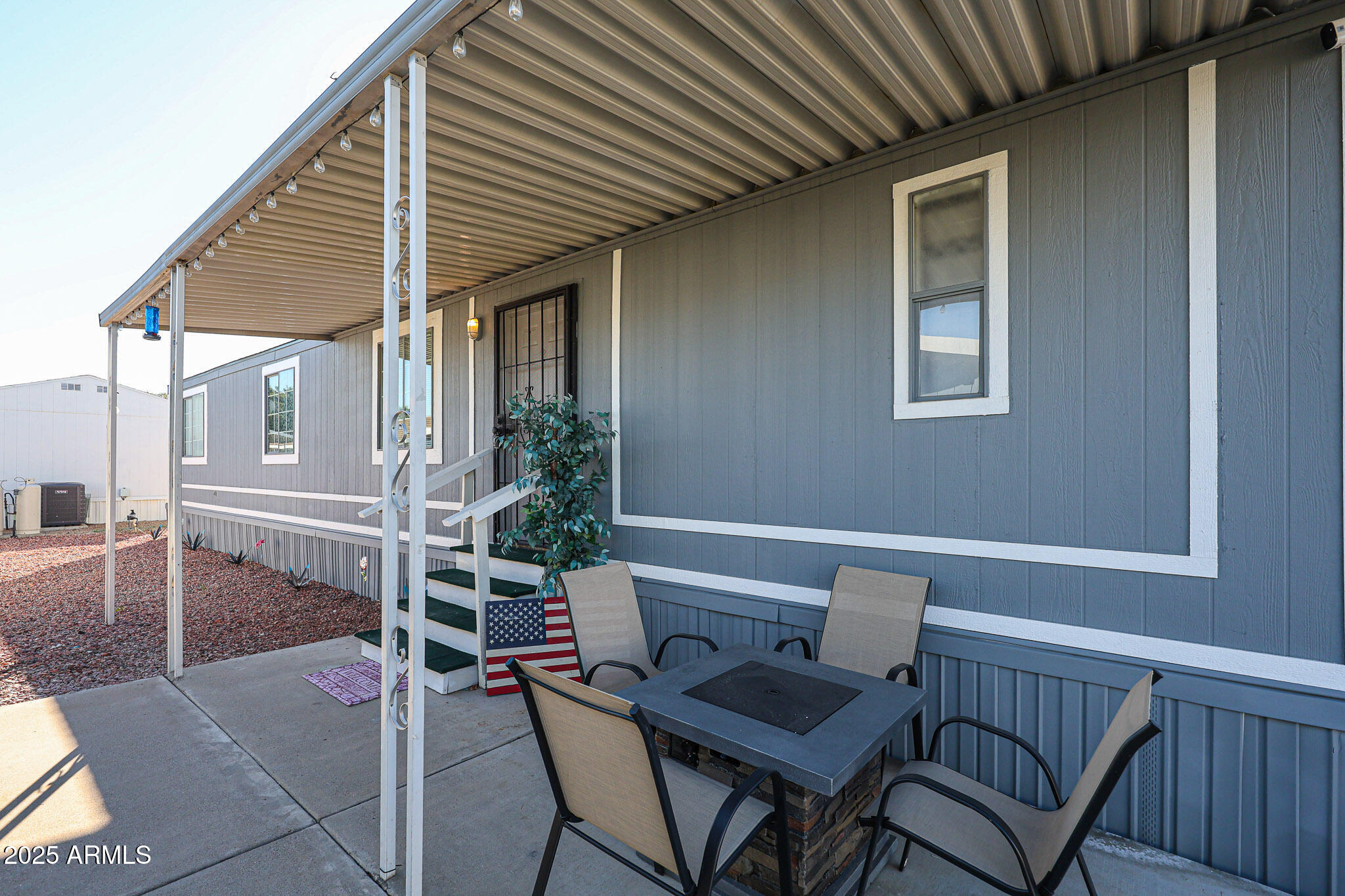 19602 North 32nd Street, Unit 32 Phoenix, AZ 85050 - Photo 5 of 37 a patio with table and chairs and potted plants
