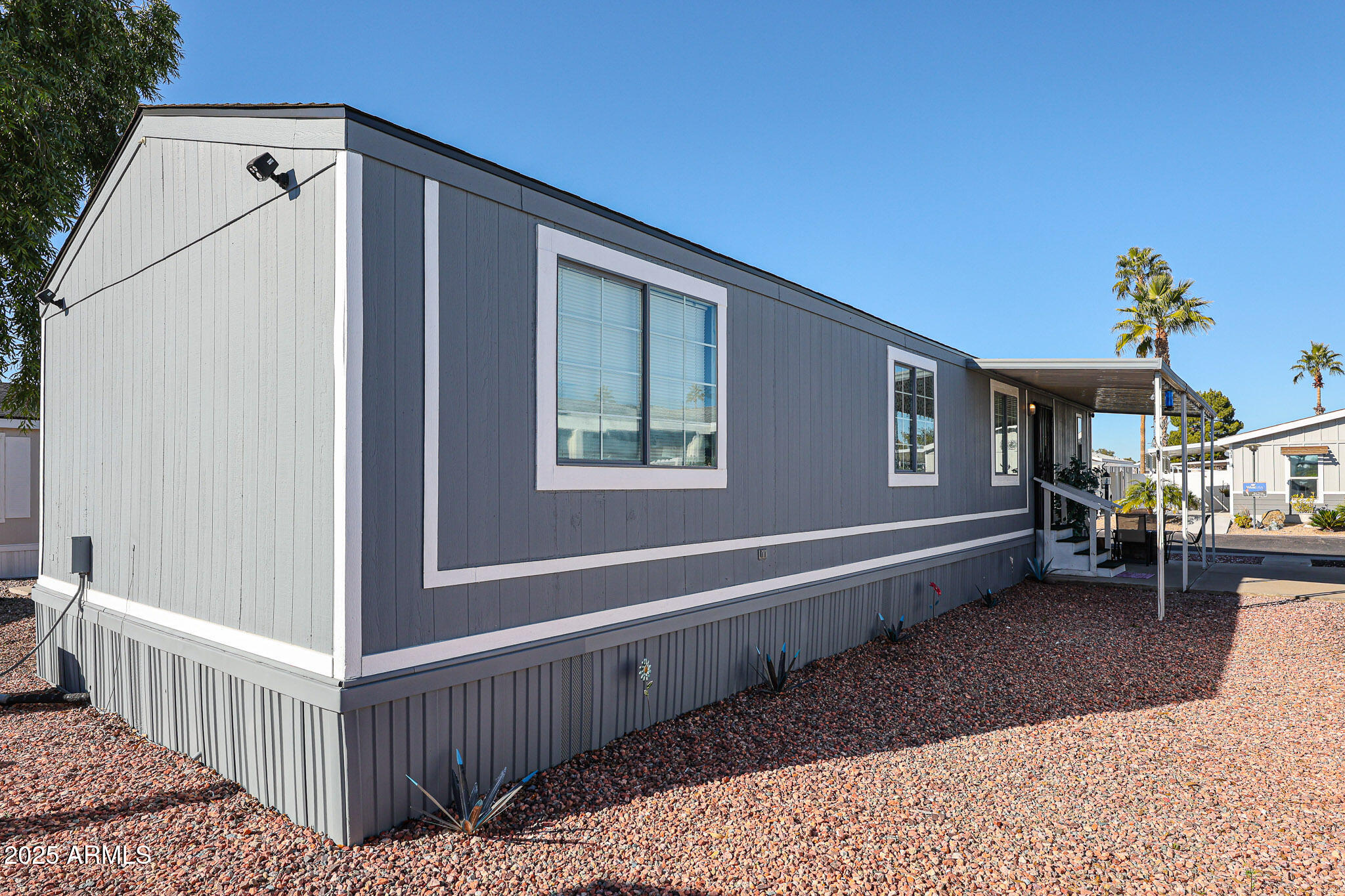 19602 North 32nd Street, Unit 32 Phoenix, AZ 85050 - Photo 6 of 37 a view of a house with a wooden fence