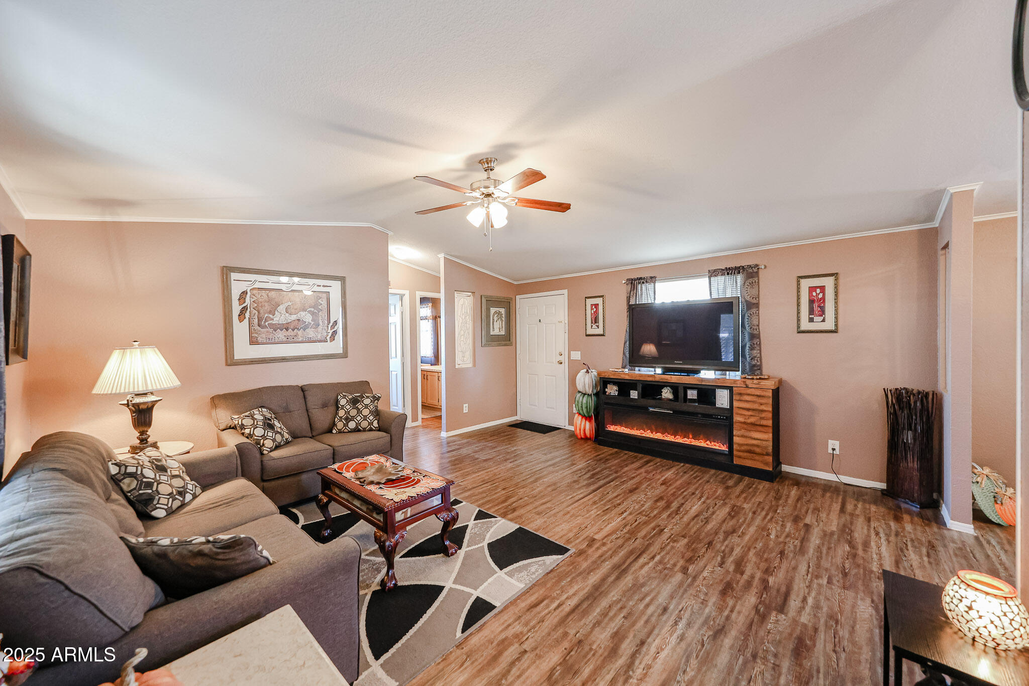 19602 North 32nd Street, Unit 32 Phoenix, AZ 85050 - Photo 10 of 37 a living room with furniture and a wooden floor