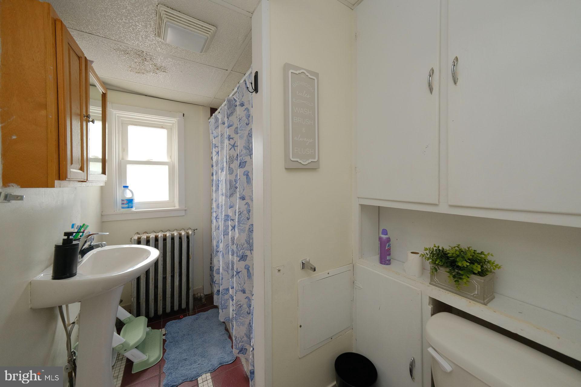 2803 Kutztown Road Reading, PA 19605 - Photo 25 of 33 a bathroom with a sink mirror and toilet
