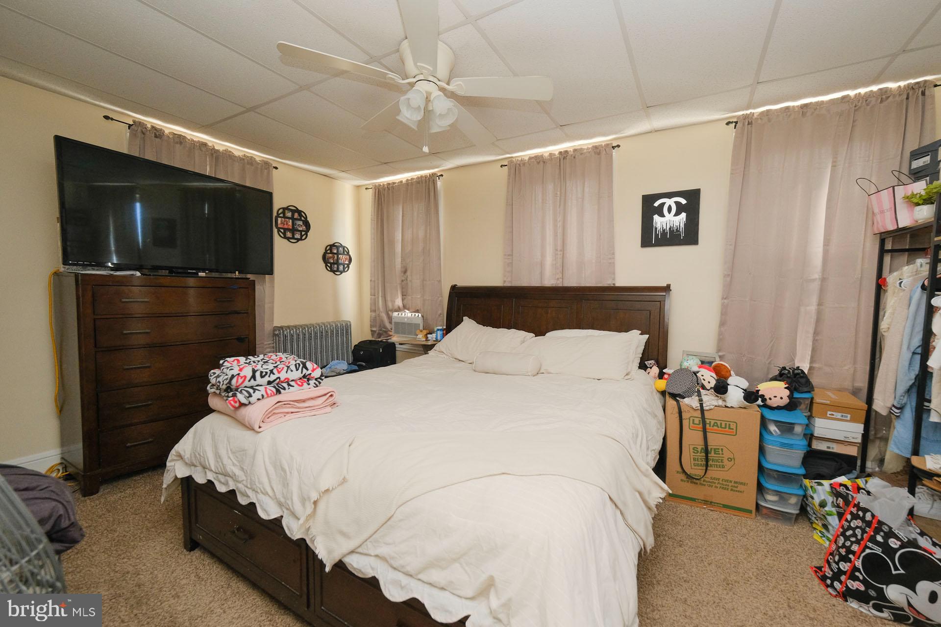2803 Kutztown Road Reading, PA 19605 - Photo 29 of 33 a bedroom with a bed and a flat screen tv