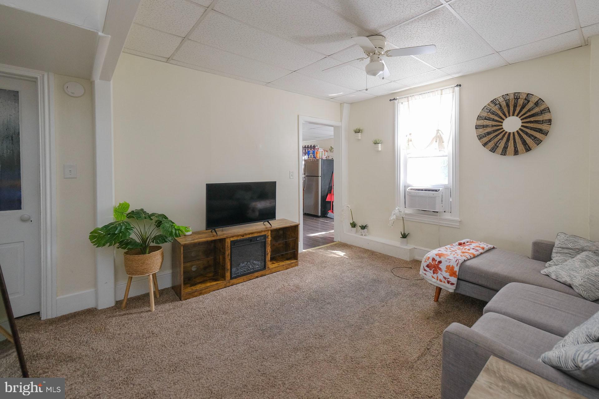 2803 Kutztown Road Reading, PA 19605 - Photo 31 of 33 a living room with furniture and a flat screen tv