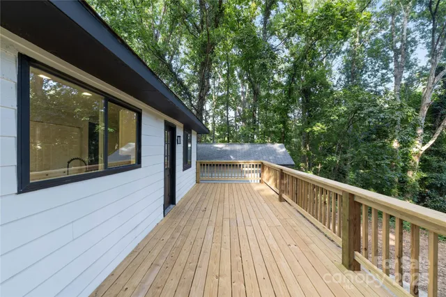 a house that has a tree in front of it