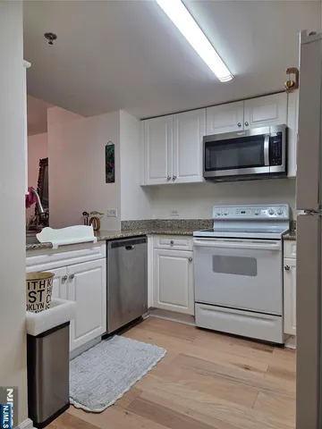 a kitchen with a stove and a microwave