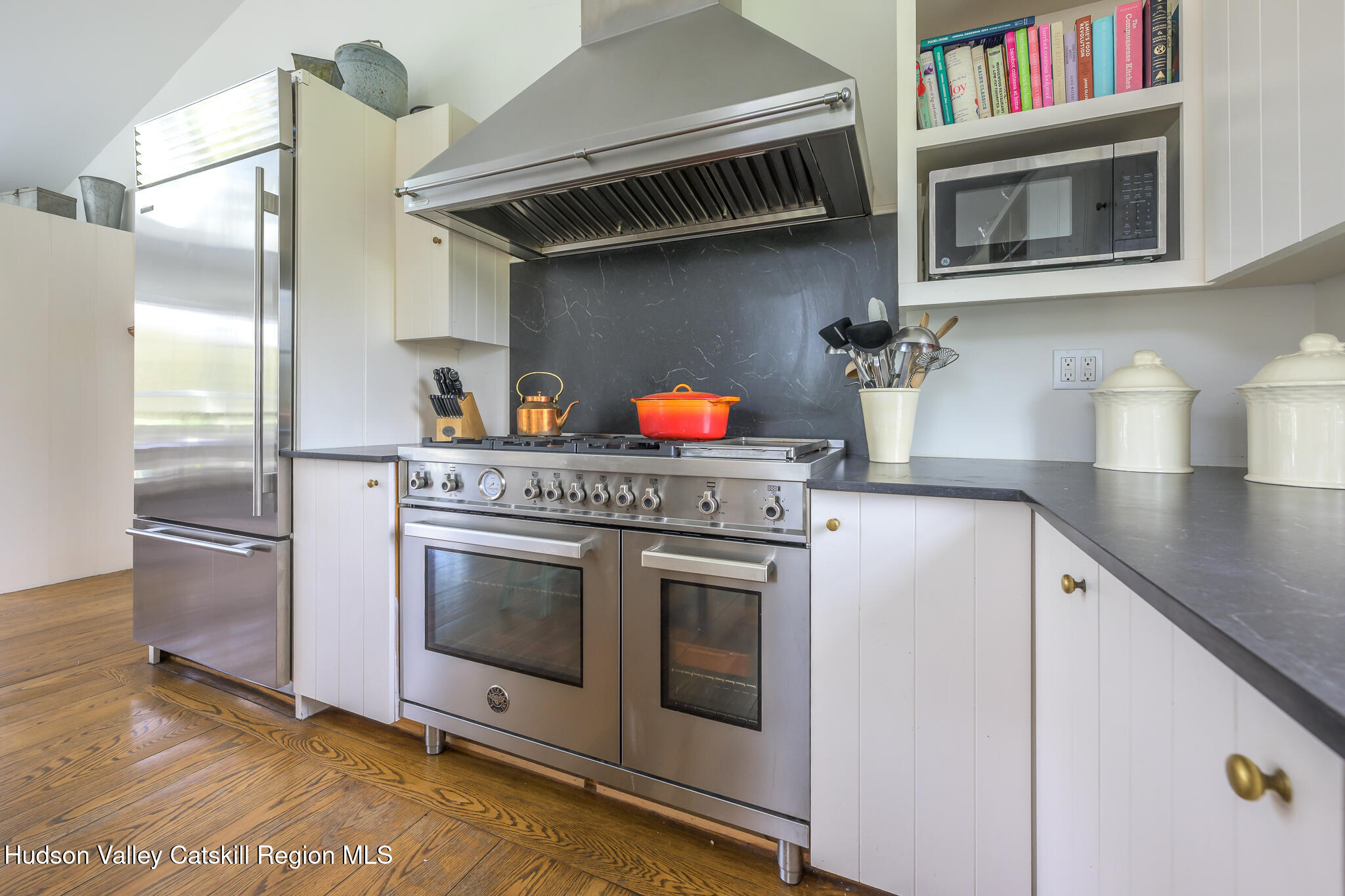 159 Riders Mills Road Old Chatham, NY 12136 - Photo 12 of 42 a kitchen with stainless steel appliances granite countertop a stove and a refrigerator