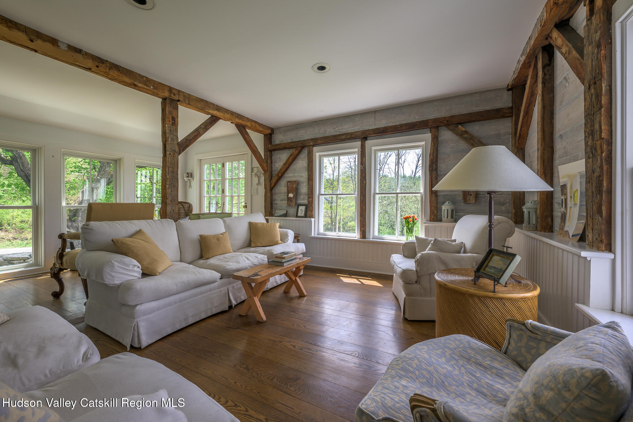 159 Riders Mills Road Old Chatham, NY 12136 - Photo 19 of 42 a living room with furniture and a large window