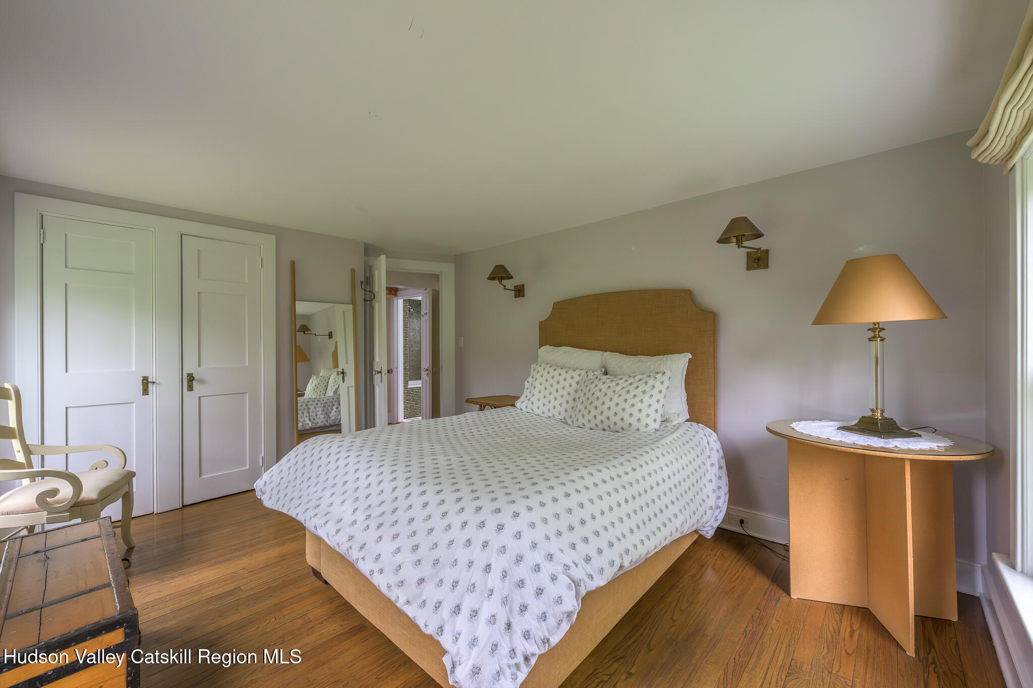 159 Riders Mills Road Old Chatham, NY 12136 - Photo 26 of 42 a bedroom with a bed and a lamp