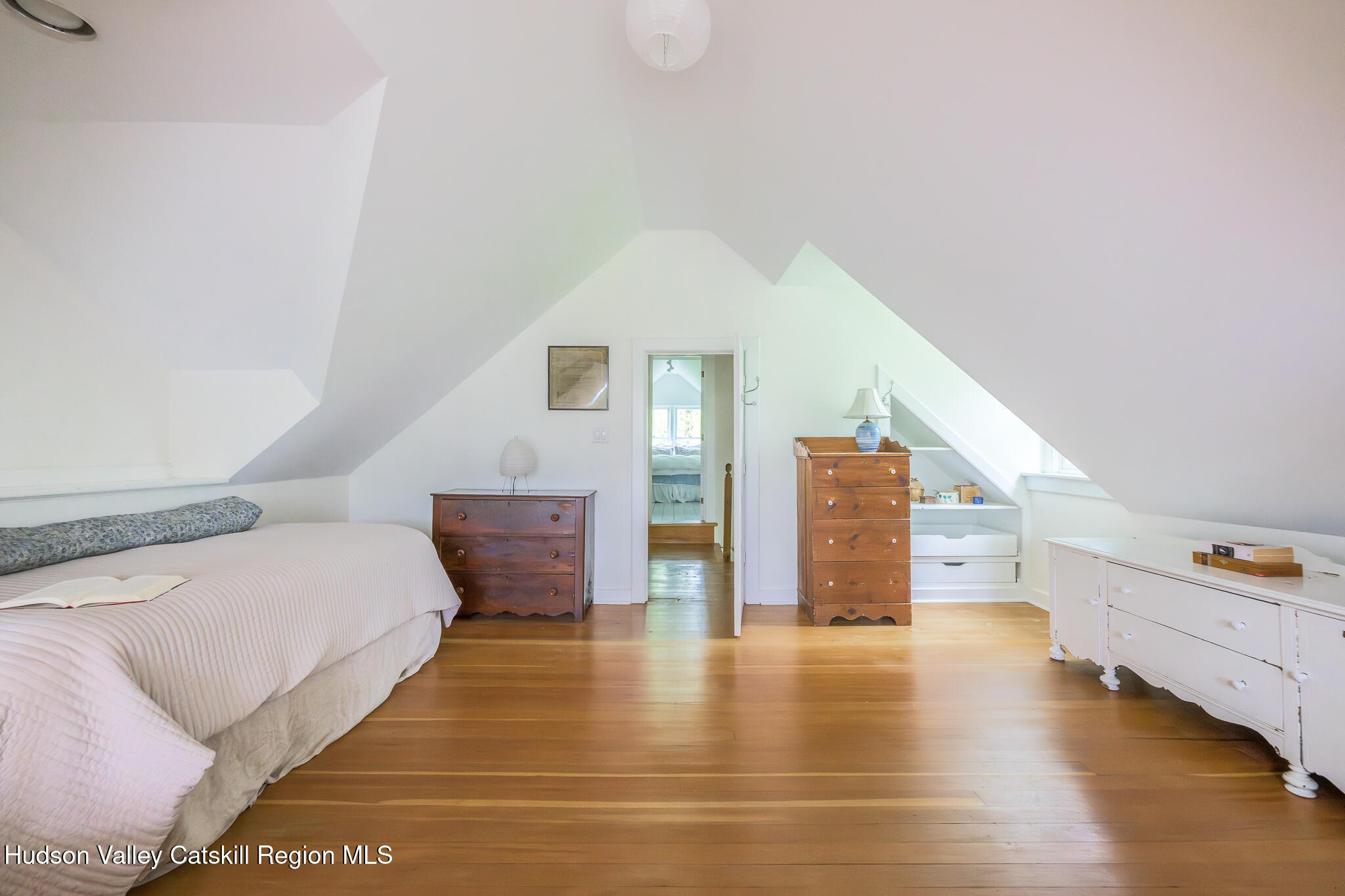 159 Riders Mills Road Old Chatham, NY 12136 - Photo 29 of 42 a view of a bedroom with wooden floor and furniture