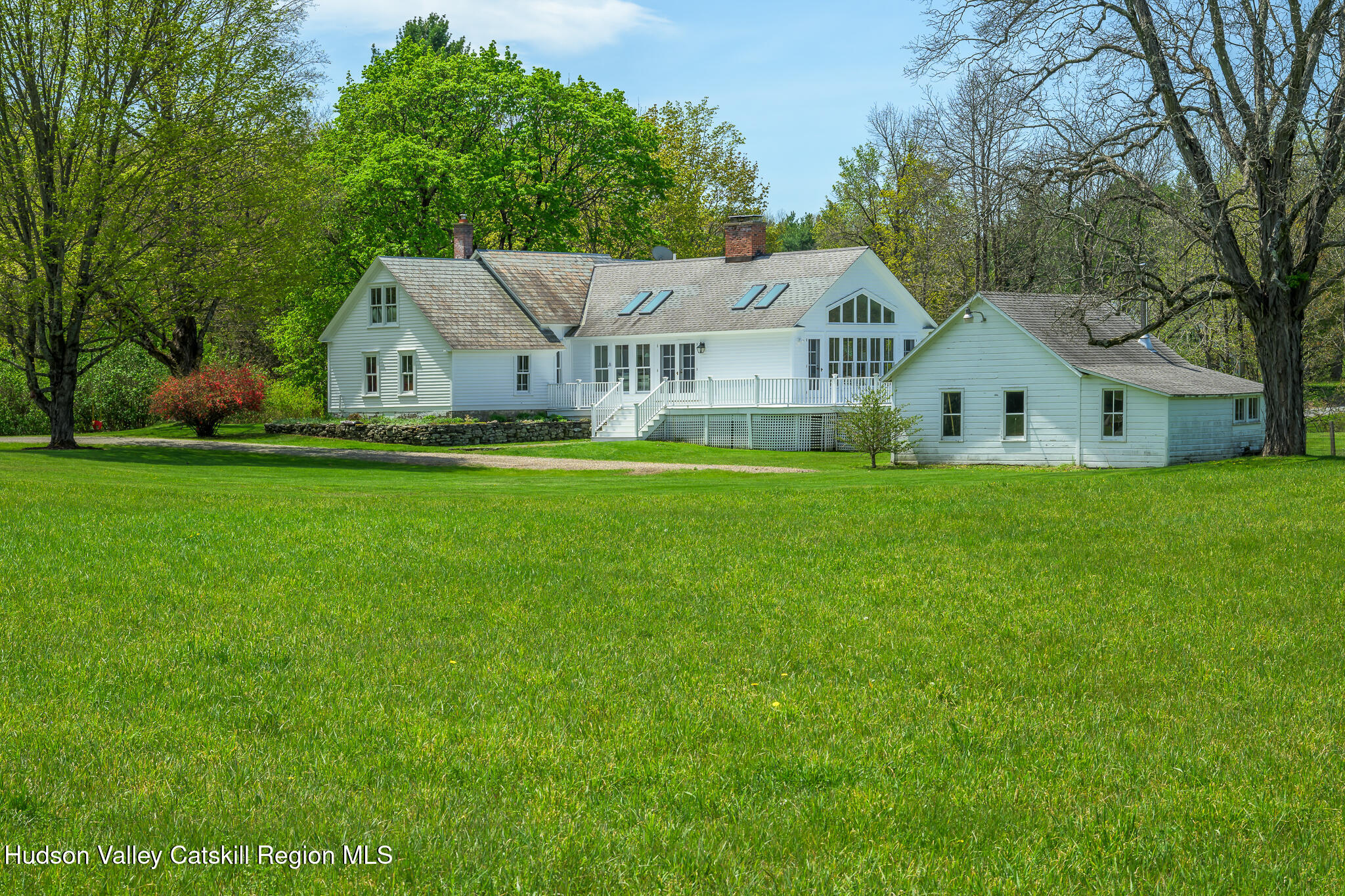 159 Riders Mills Road Old Chatham, NY 12136 - Photo 33 of 42 a front view of a house with a garden and trees