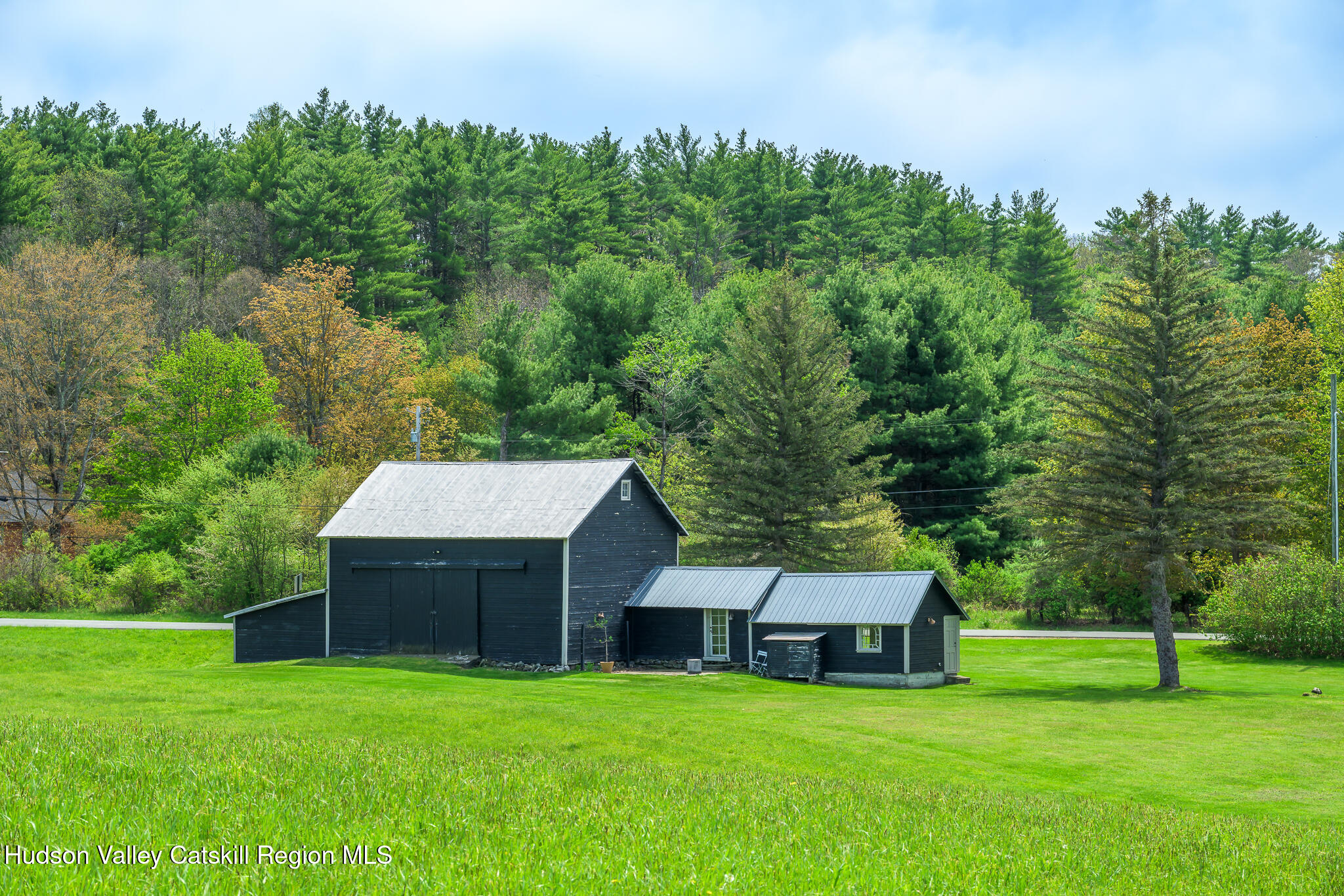 159 Riders Mills Road Old Chatham, NY 12136 - Photo 5 of 42 a front view of a house with garden