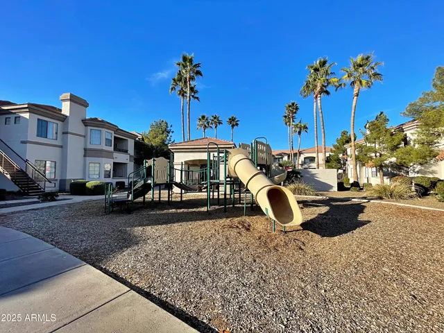 a outdoor space with lots of furniture and swimming pool