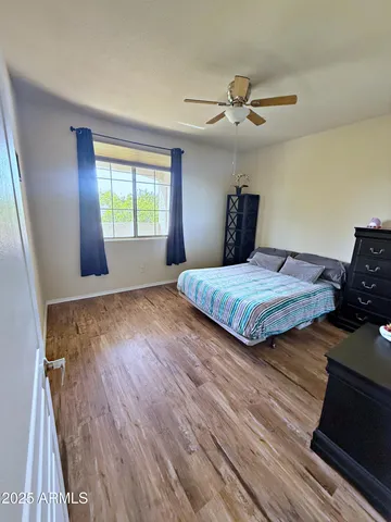 a spacious bathroom with a double vanity sink a mirror and a shower