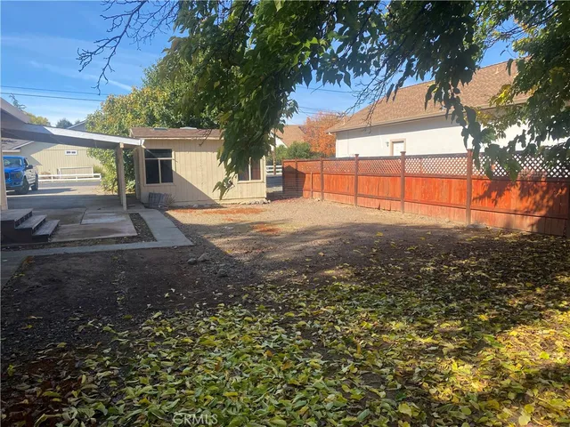 a view of a backyard of the house