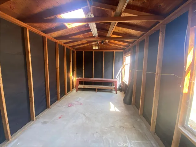 a view of an empty room with a garage