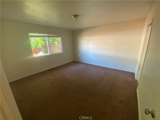 a kitchen with a refrigerator a sink and a stove