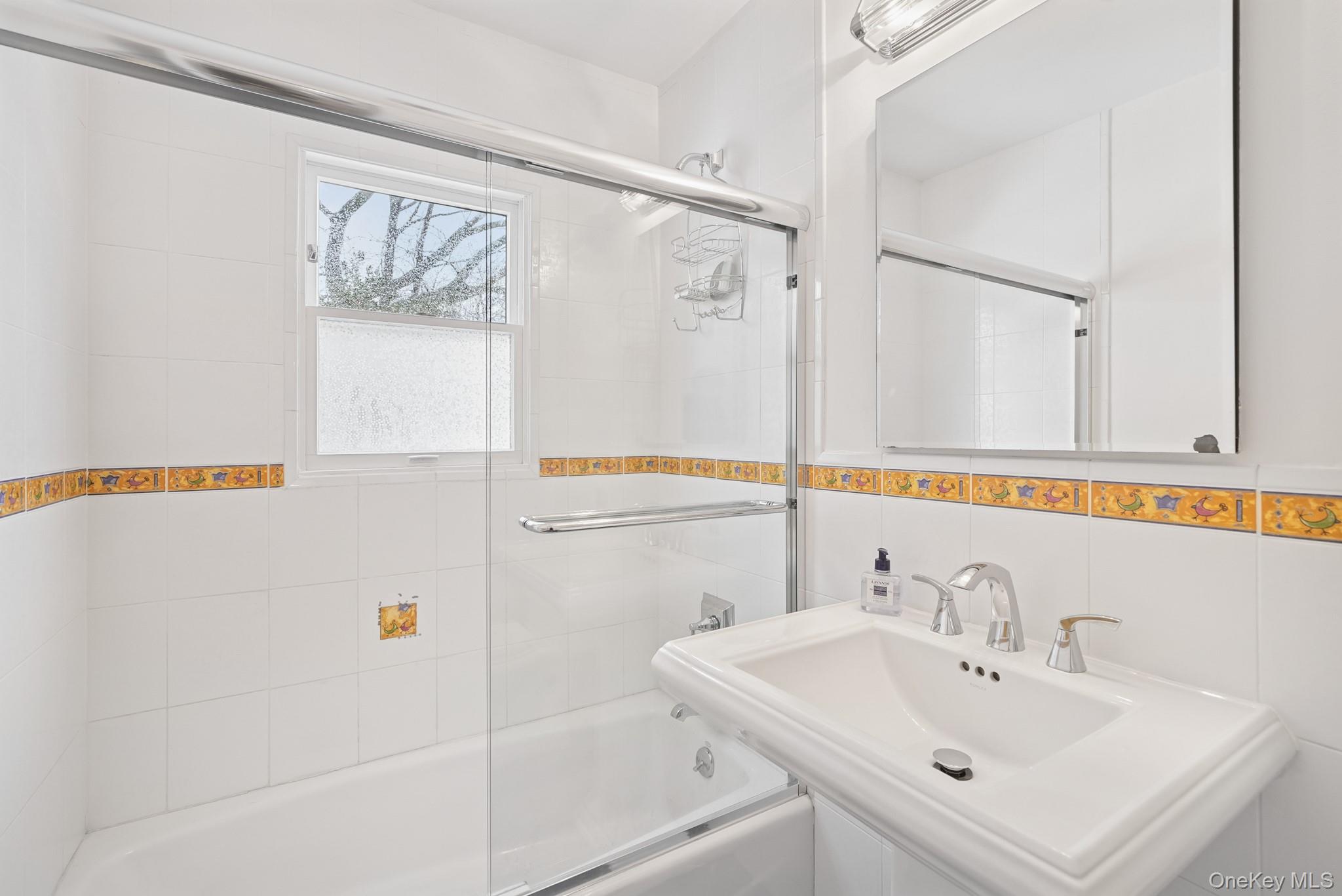 33 Overlook Road Ardsley, NY 10502 - Photo 19 of 32 a bathroom with a sink and a mirror