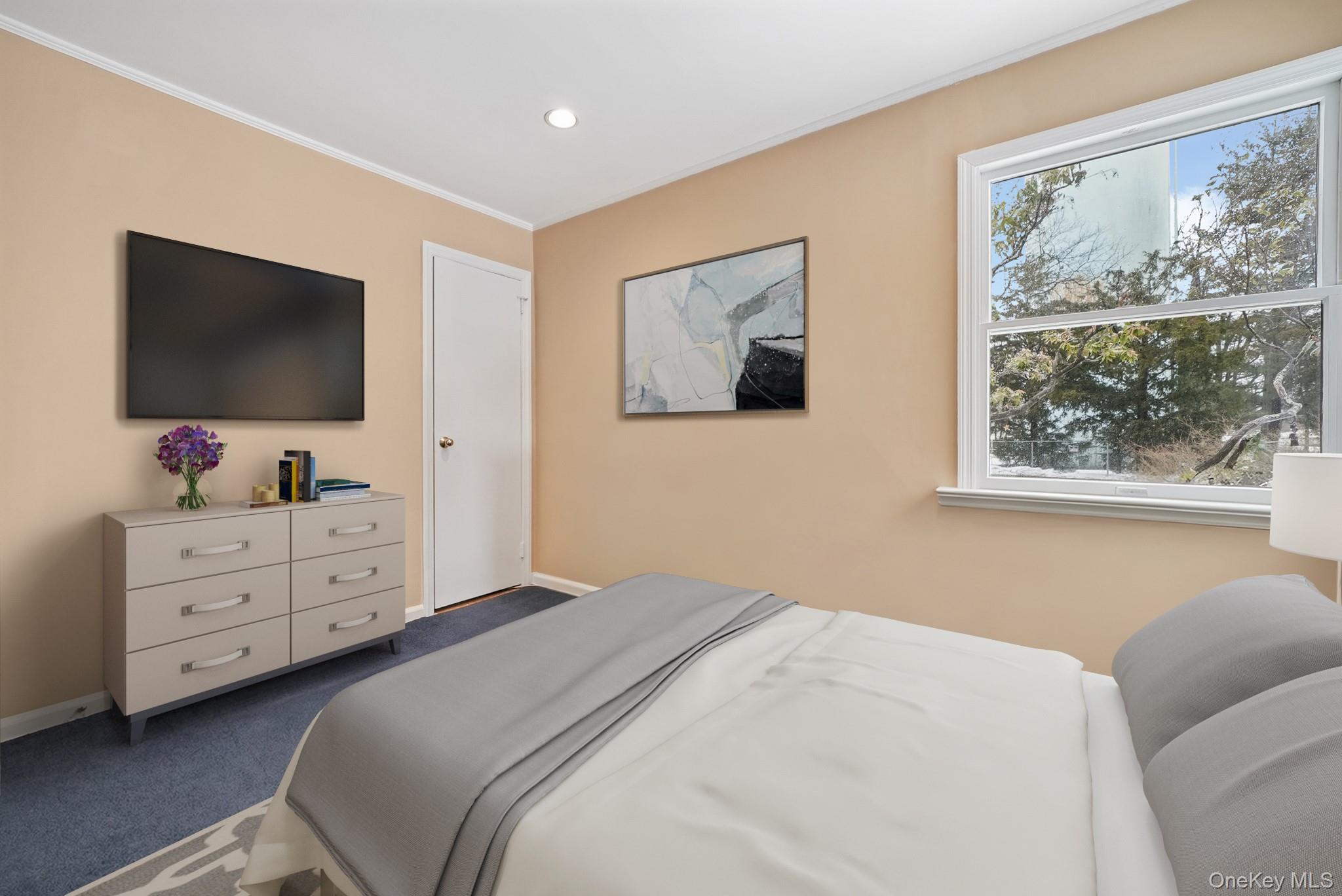 33 Overlook Road Ardsley, NY 10502 - Photo 21 of 32 a bedroom with a bed and a flat screen tv