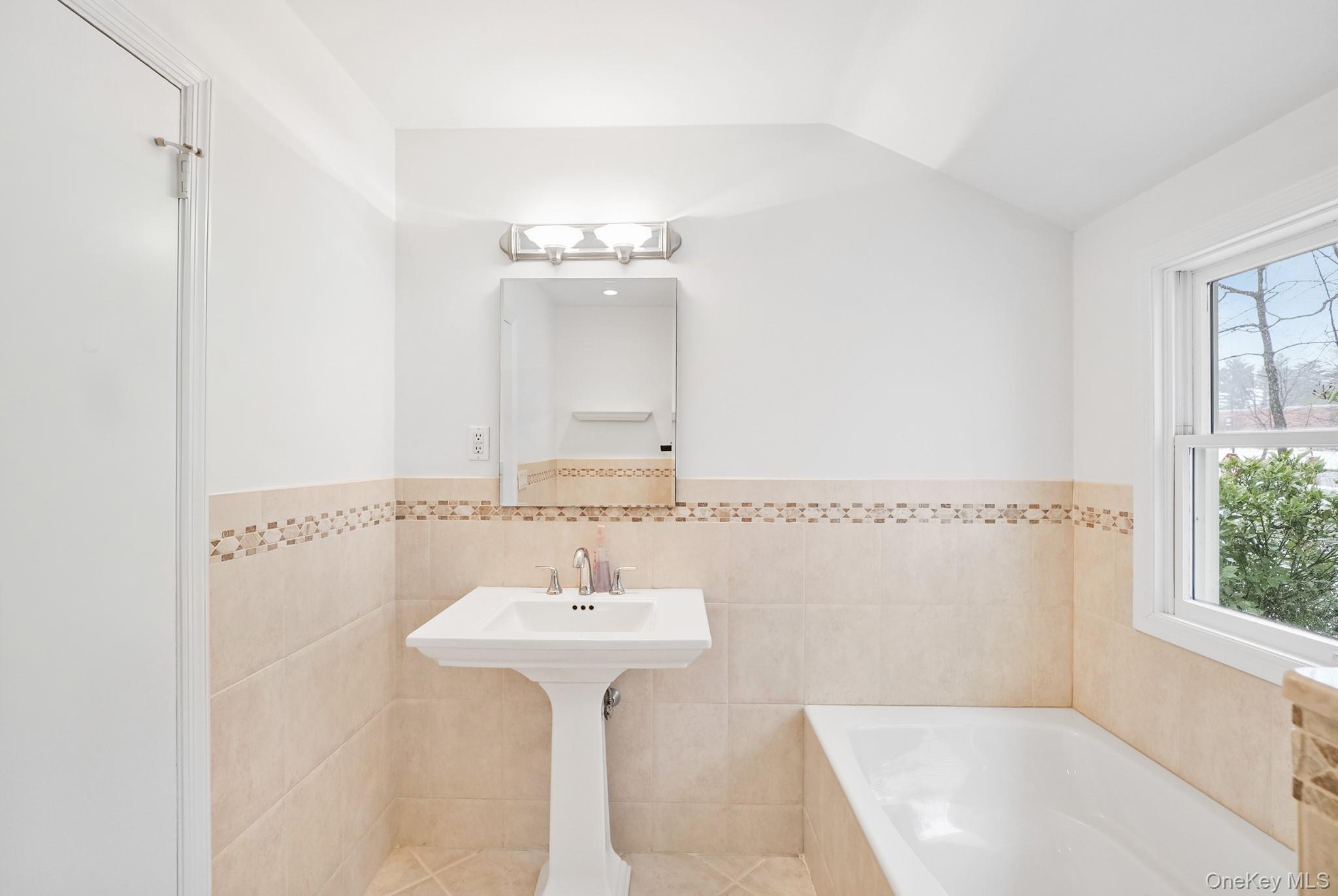 33 Overlook Road Ardsley, NY 10502 - Photo 24 of 32 a bathroom with a sink a mirror and shower