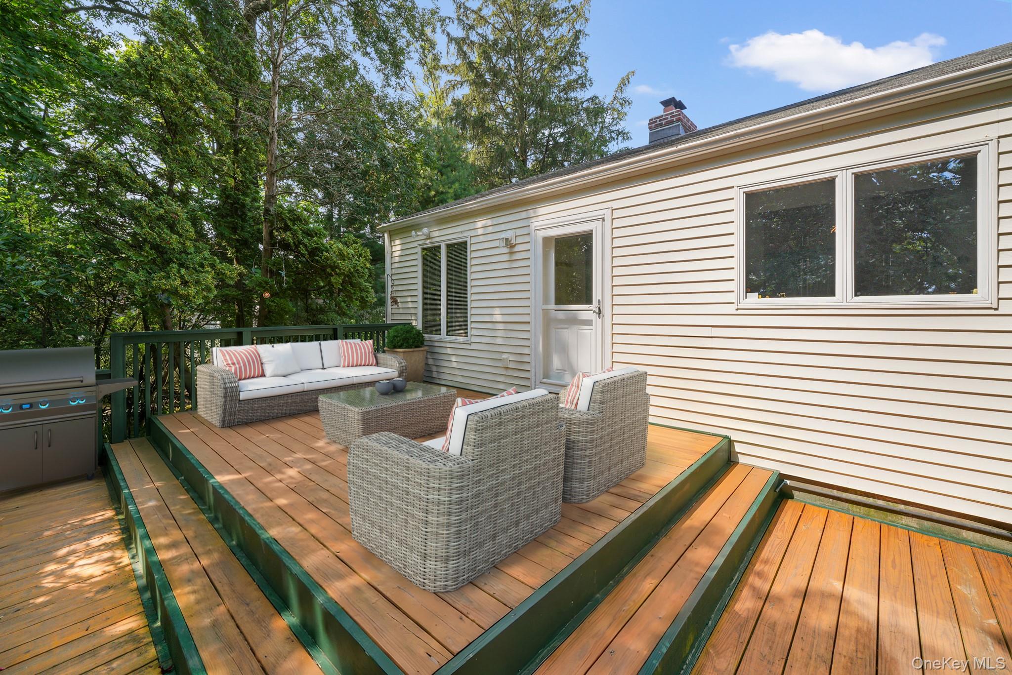 33 Overlook Road Ardsley, NY 10502 - Photo 25 of 32 a view of a patio with couches chairs and wooden floor