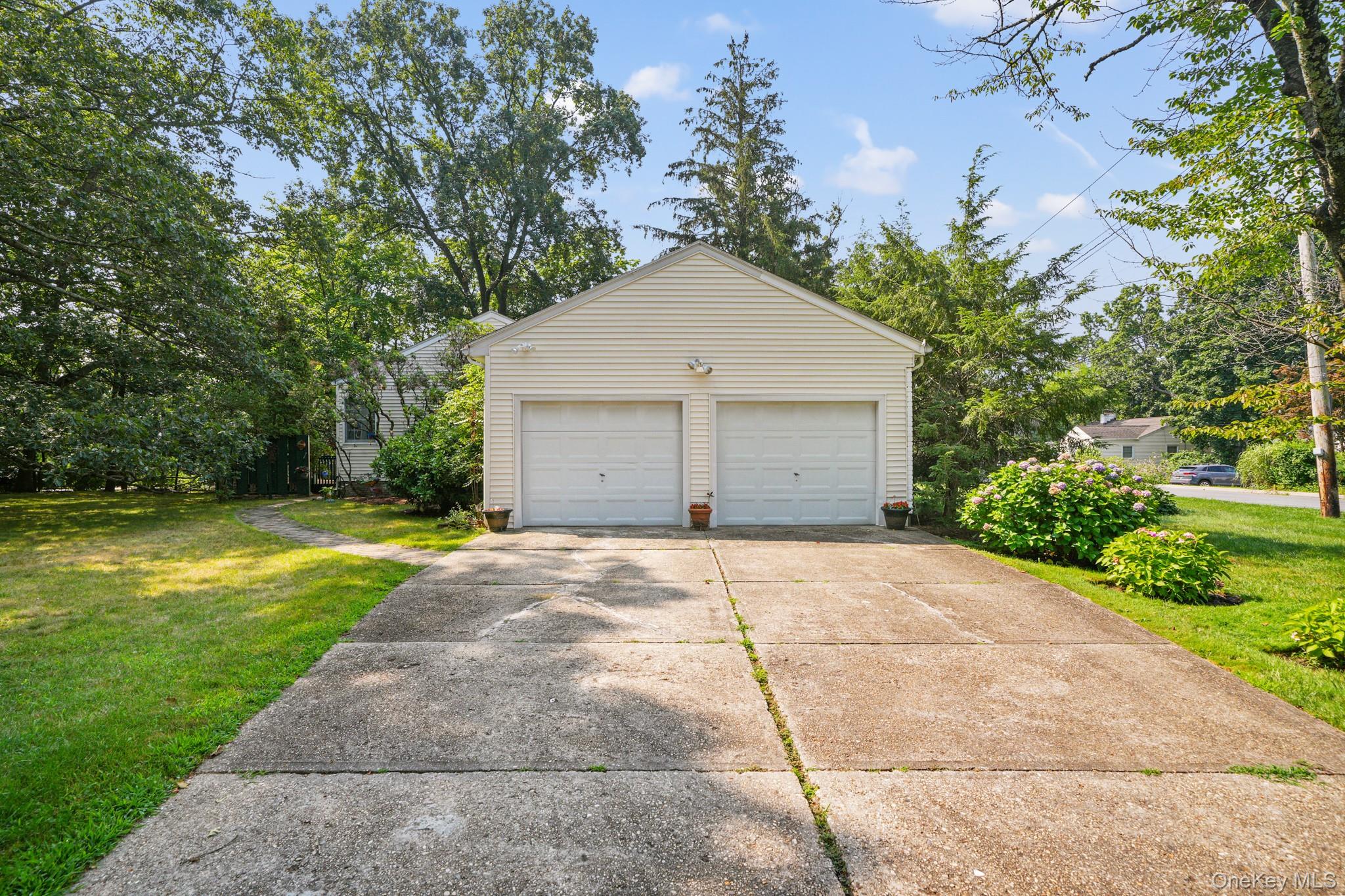33 Overlook Road Ardsley, NY 10502 - Photo 26 of 32 a view of backyard of house and garage