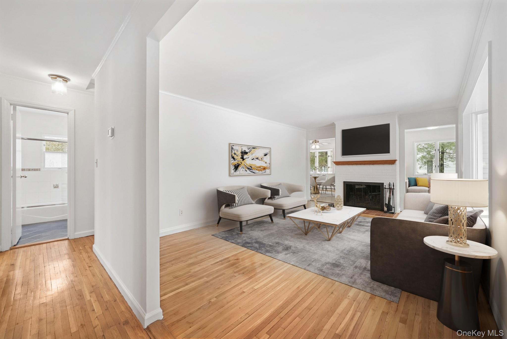 33 Overlook Road Ardsley, NY 10502 - Photo 4 of 32 a living room with furniture a fireplace and a flat screen tv
