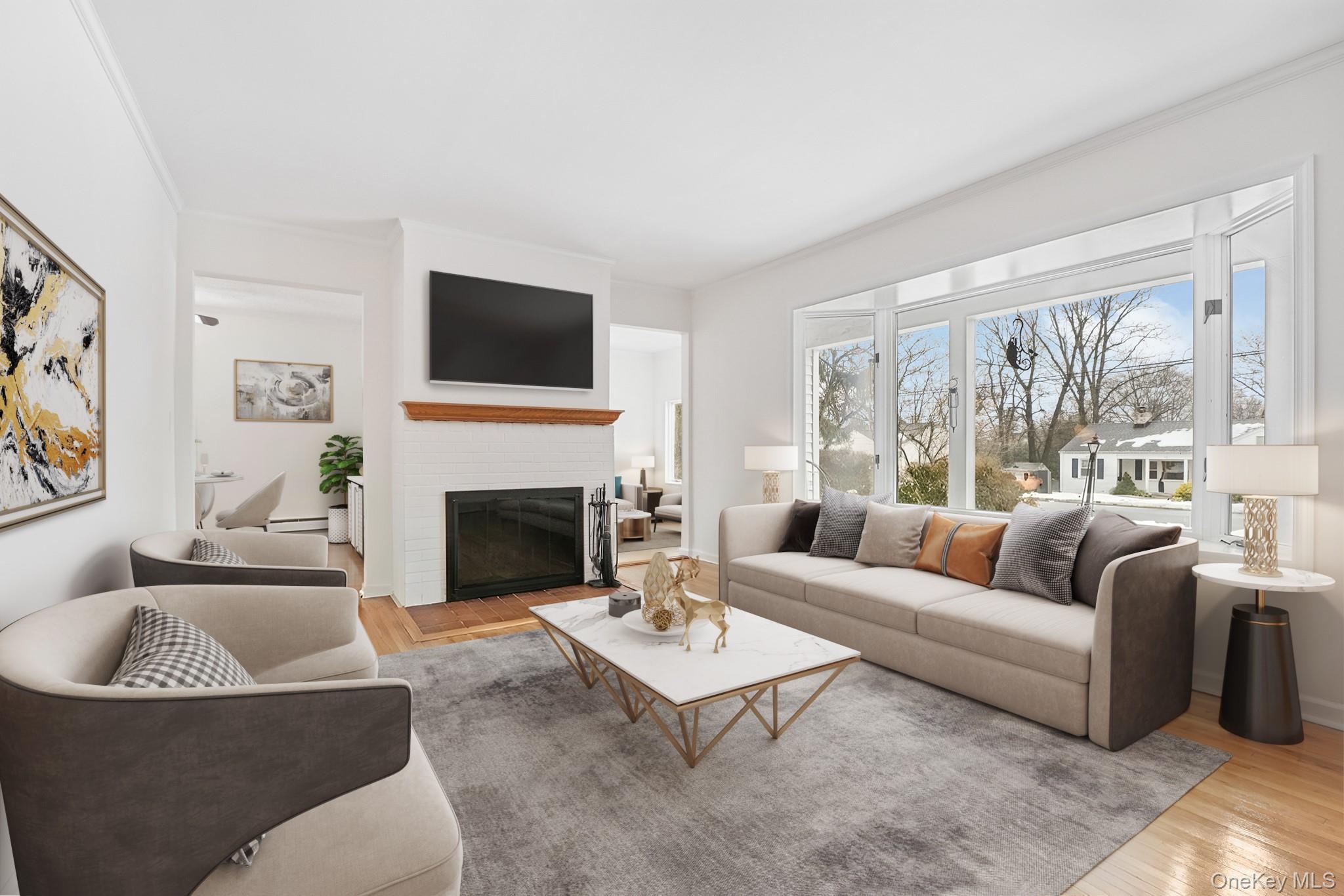 33 Overlook Road Ardsley, NY 10502 - Photo 6 of 32 a living room with furniture a fireplace and a flat screen tv