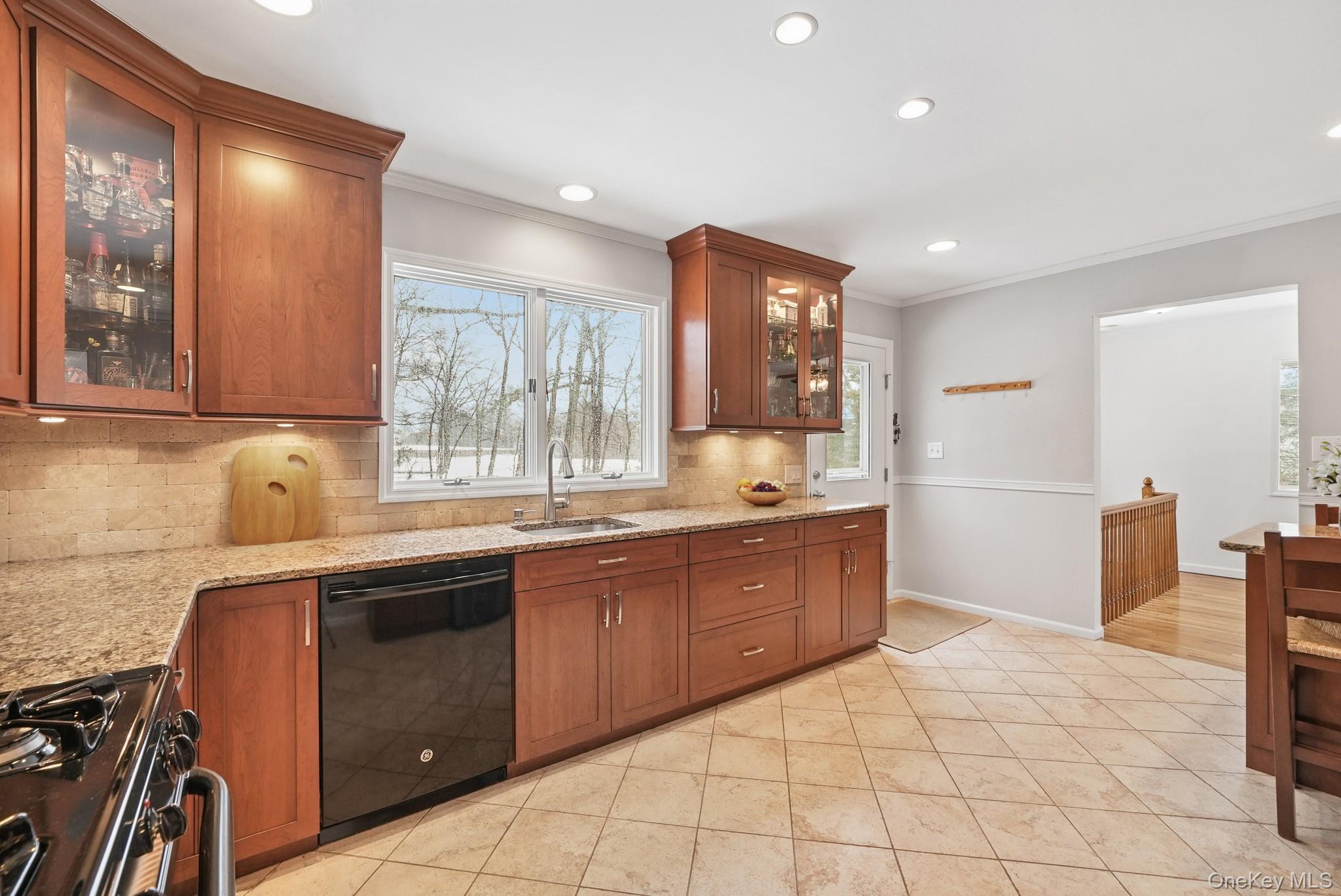 33 Overlook Road Ardsley, NY 10502 - Photo 10 of 32 a kitchen with stainless steel appliances granite countertop a sink and cabinets