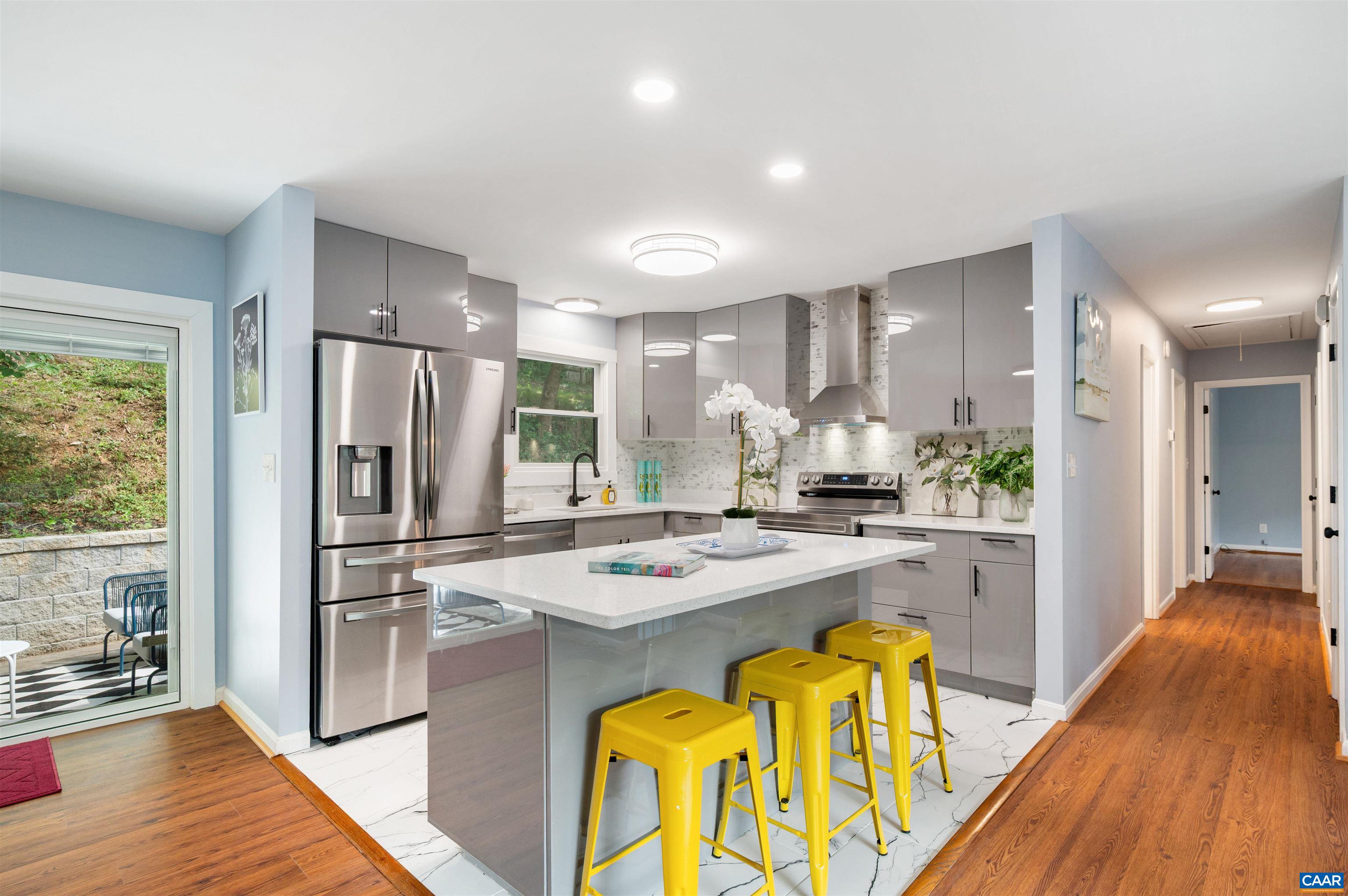 2232 Brandywine Drive Charlottesville, VA 22901 - Photo 11 of 53 a kitchen with stainless steel appliances granite countertop a refrigerator a stove and a wooden floors