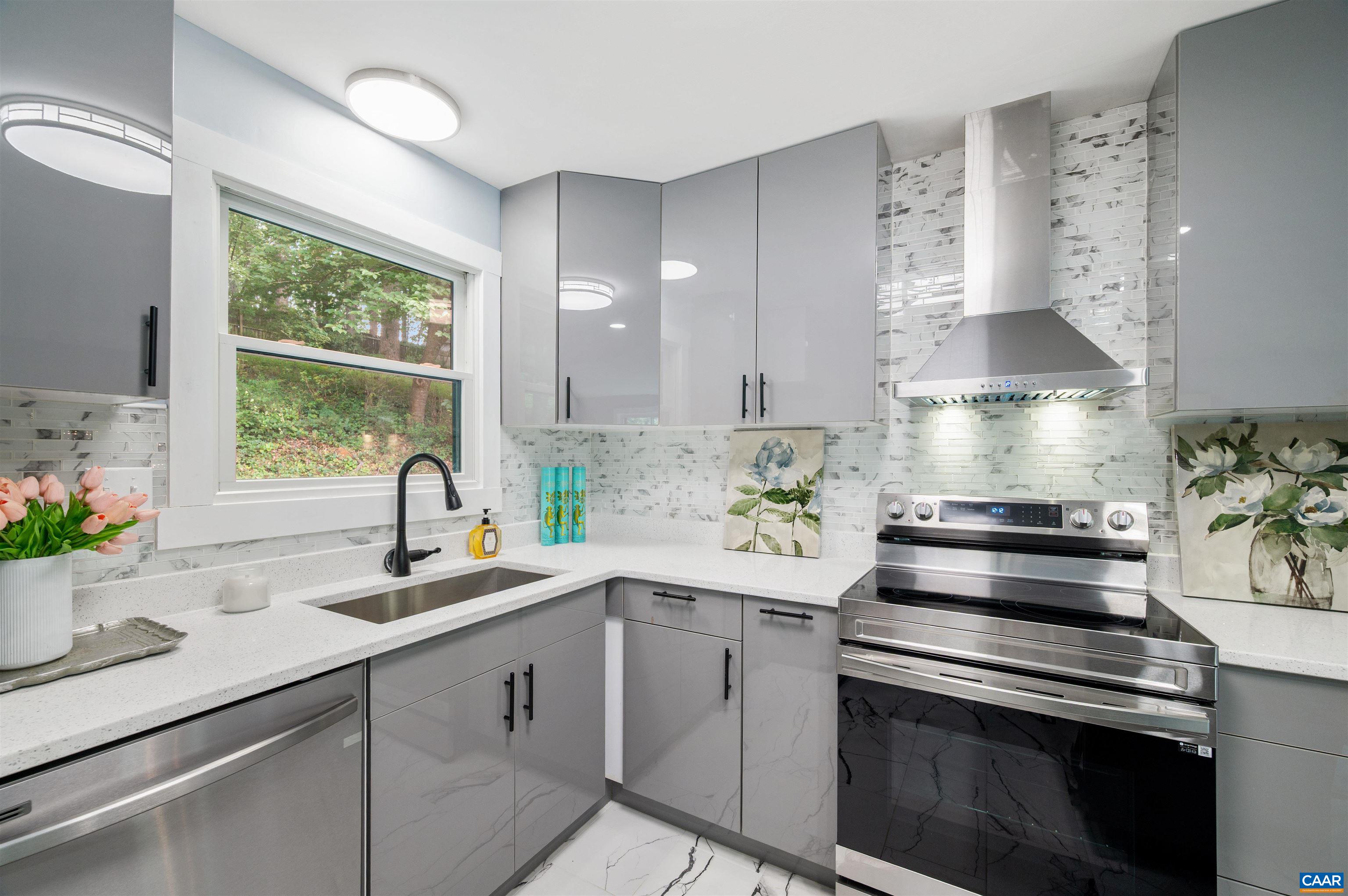 2232 Brandywine Drive Charlottesville, VA 22901 - Photo 15 of 53 a kitchen with a sink stove and cabinets