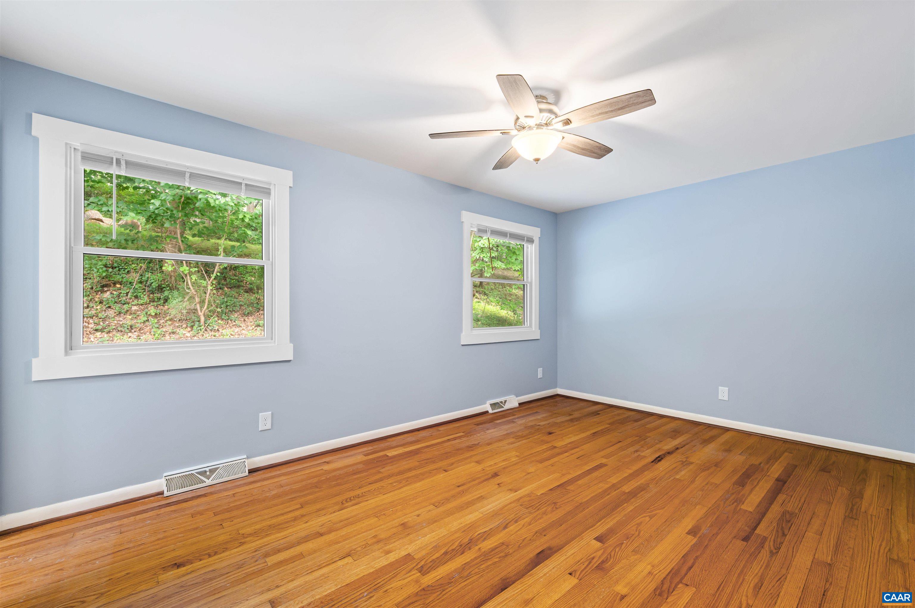 2232 Brandywine Drive Charlottesville, VA 22901 - Photo 19 of 53 a view of an empty room with wooden floor and a window