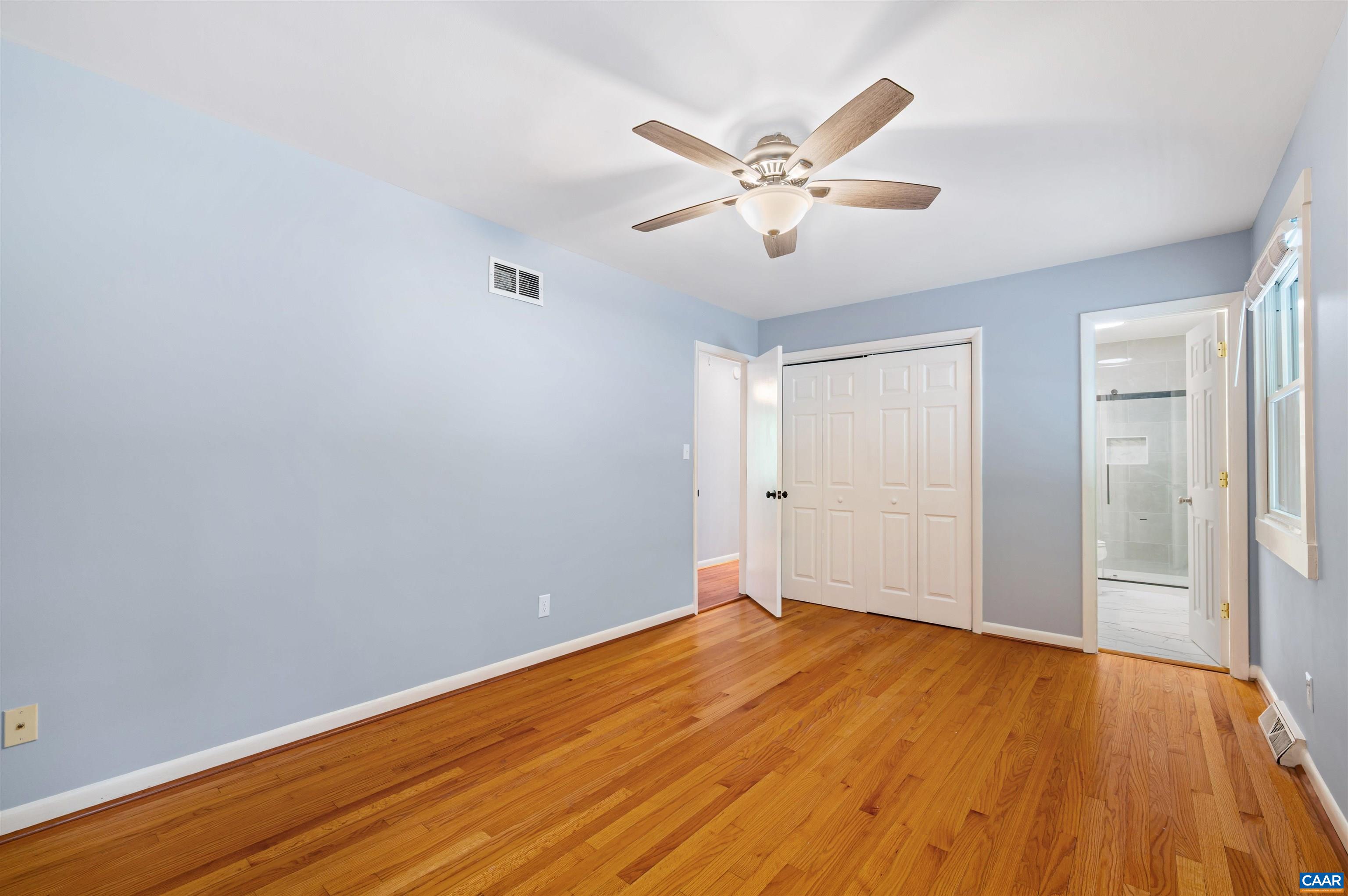 2232 Brandywine Drive Charlottesville, VA 22901 - Photo 20 of 53 a view of a big room with wooden floor and closet area