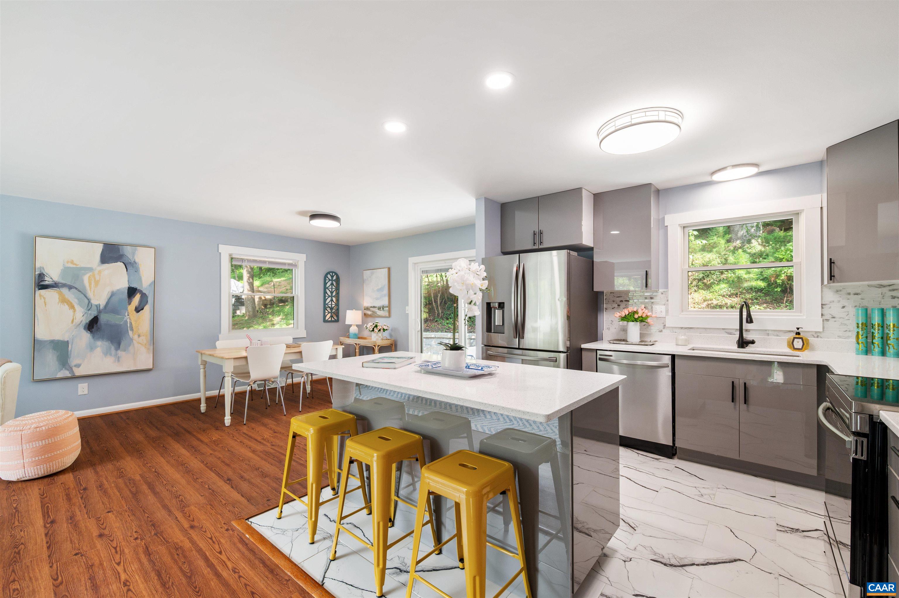 2232 Brandywine Drive Charlottesville, VA 22901 - Photo 2 of 53 a kitchen with sink refrigerator dining table and chairs
