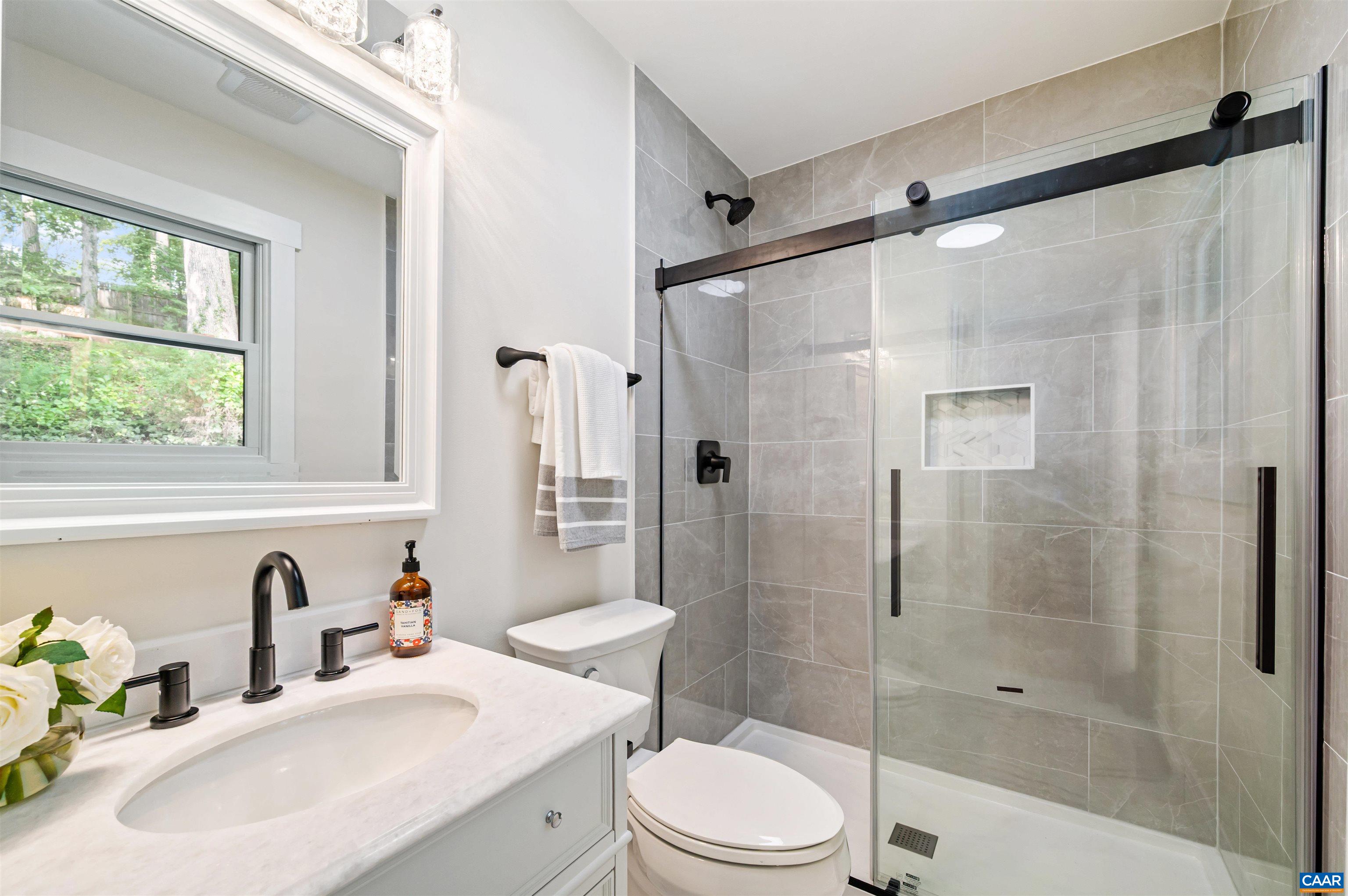 2232 Brandywine Drive Charlottesville, VA 22901 - Photo 21 of 53 a bathroom with a sink toilet and shower