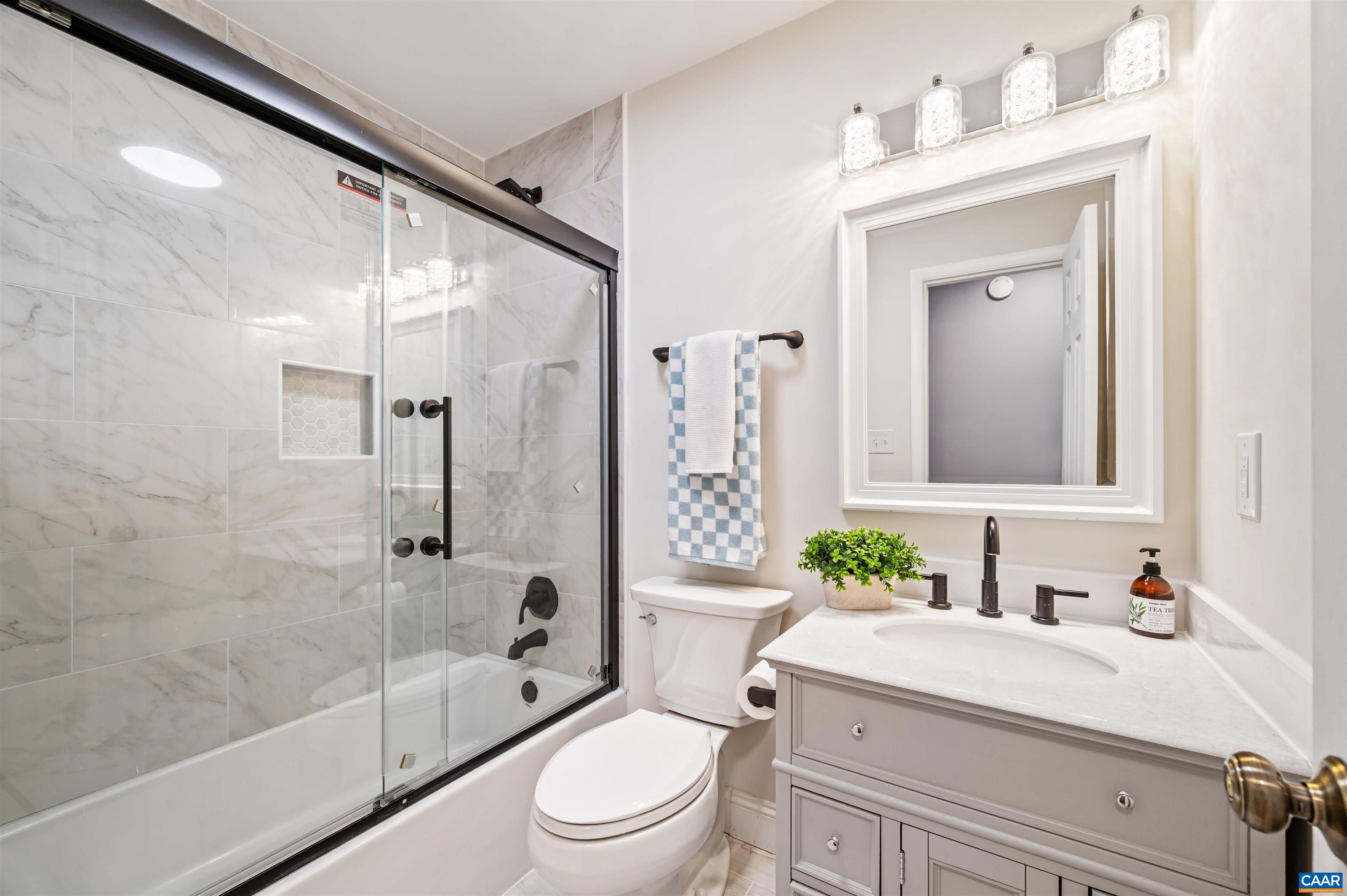 2232 Brandywine Drive Charlottesville, VA 22901 - Photo 24 of 53 a bathroom with a sink a toilet and shower