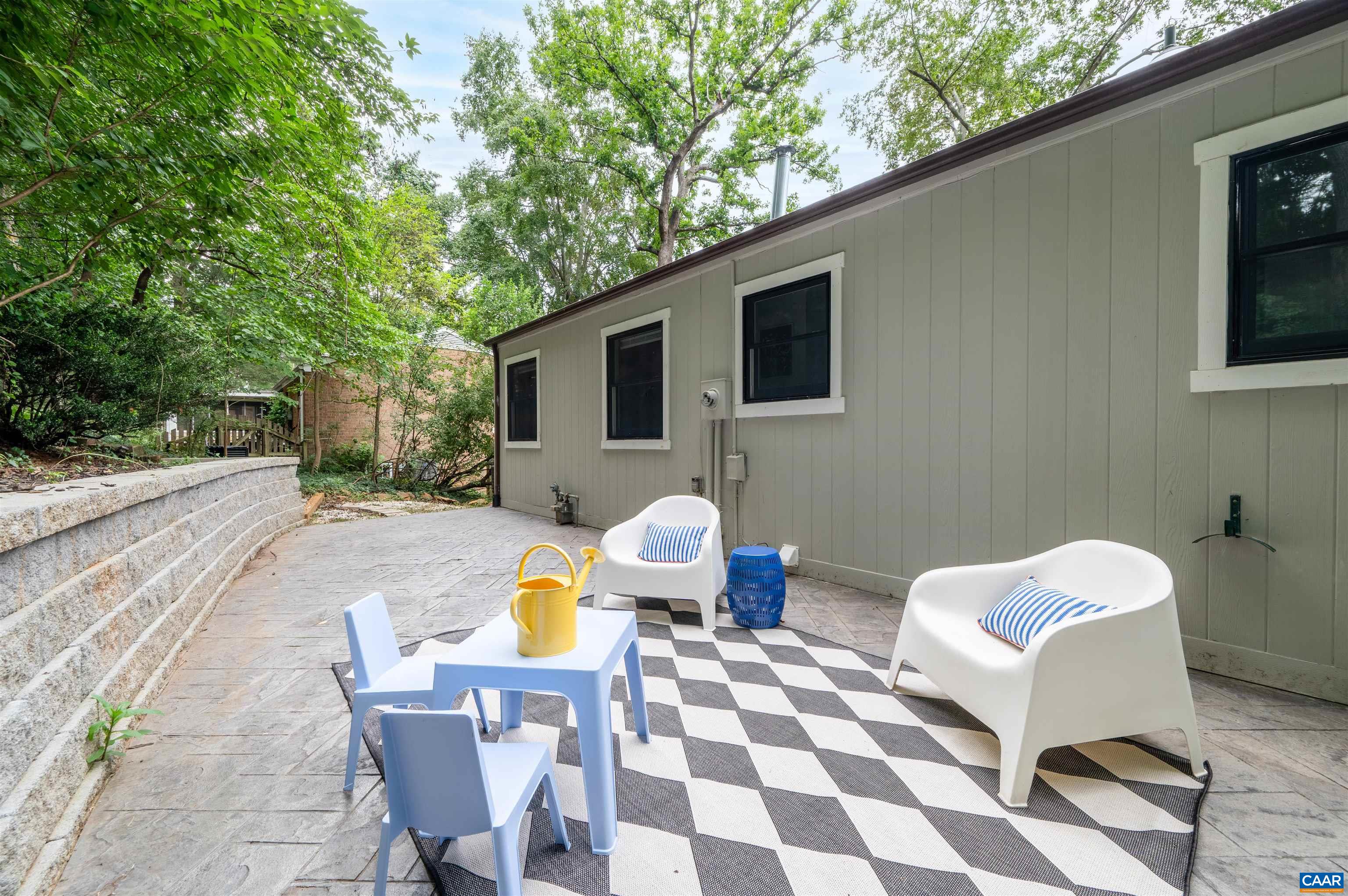 2232 Brandywine Drive Charlottesville, VA 22901 - Photo 41 of 53 a view of a patio with a dining table and chairs with wooden fence