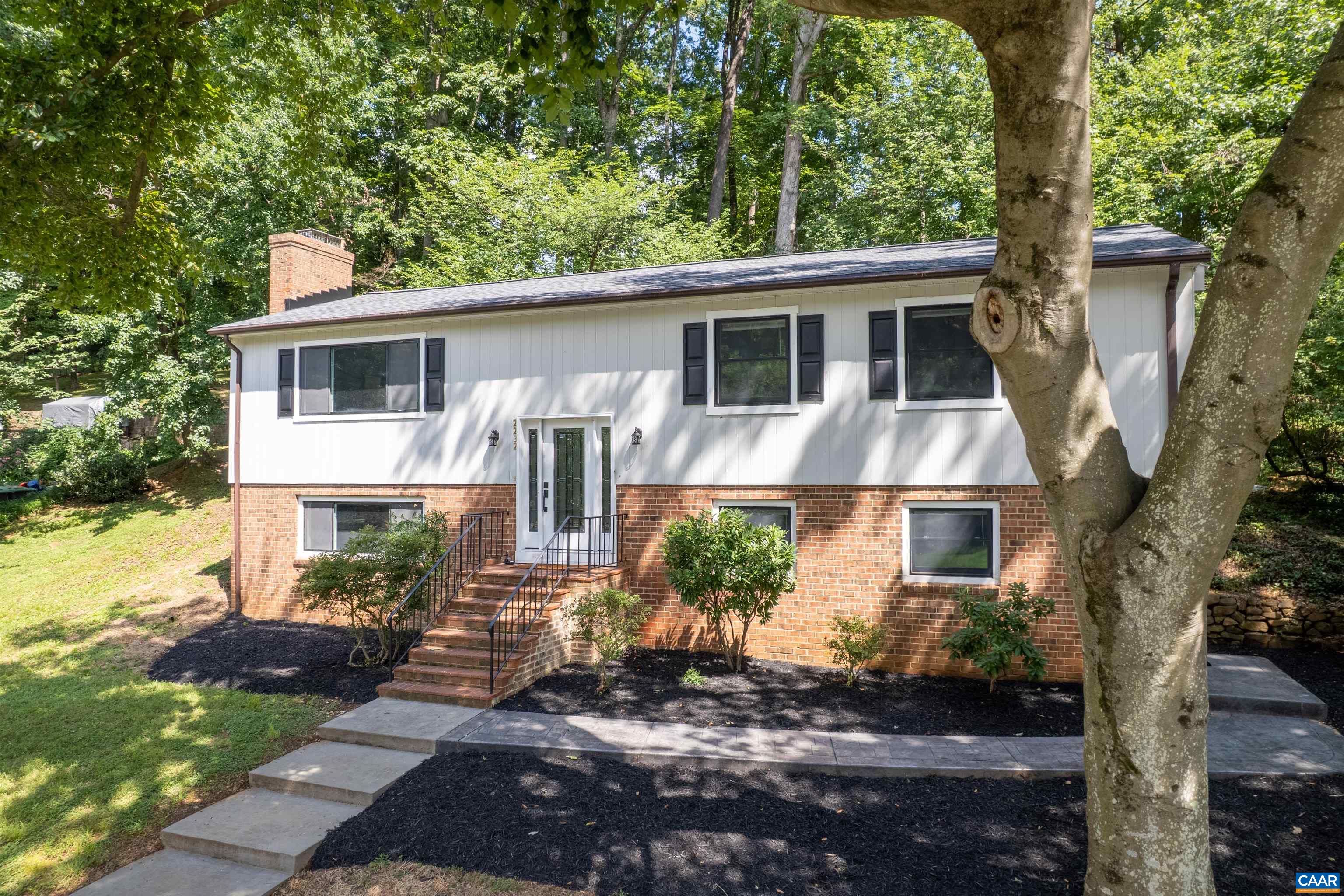 2232 Brandywine Drive Charlottesville, VA 22901 - Photo 44 of 53 a view of a yard in front of a house with plants and large tree
