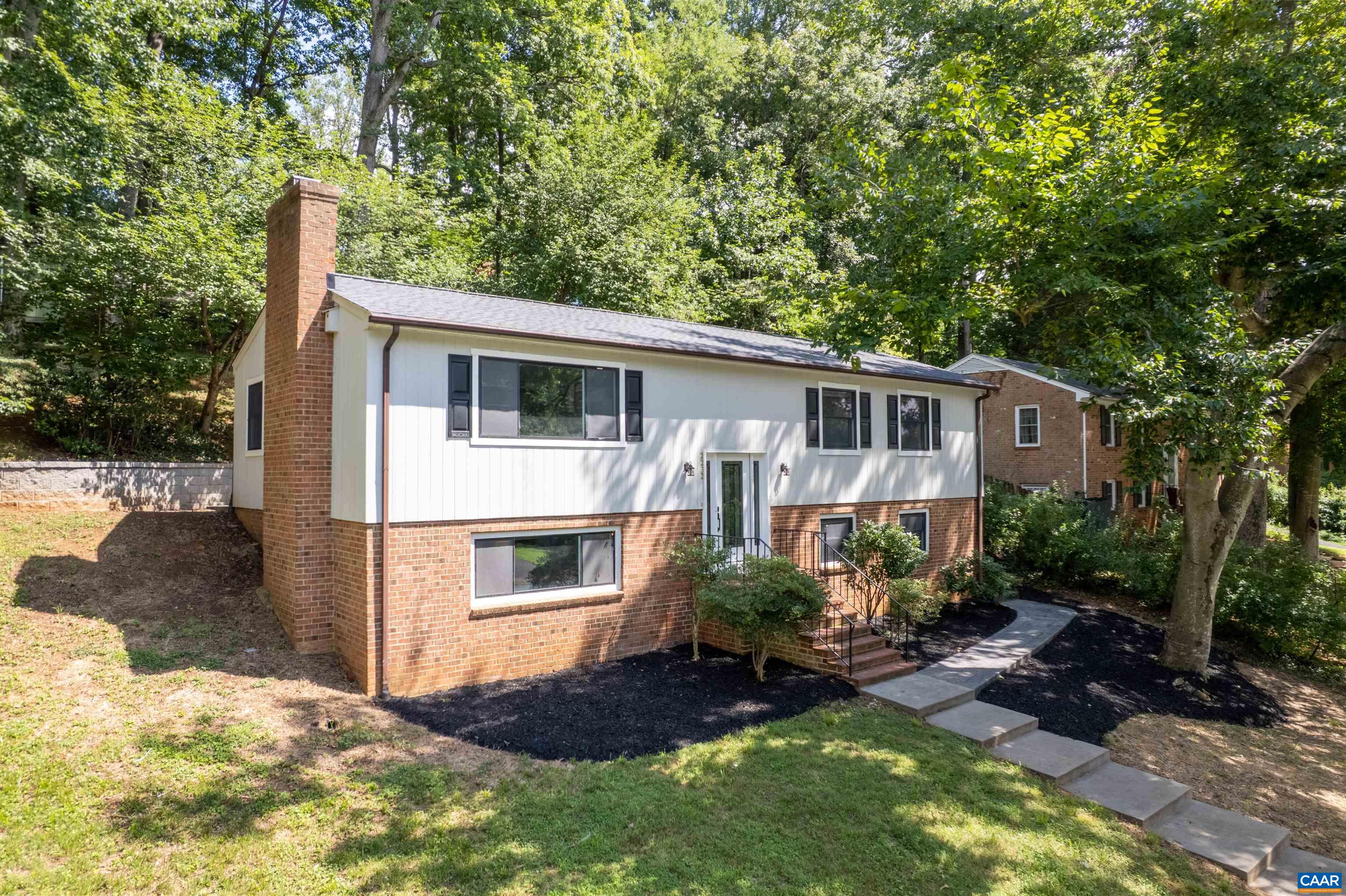2232 Brandywine Drive Charlottesville, VA 22901 - Photo 46 of 53 a front view of house with yard and trees in the background
