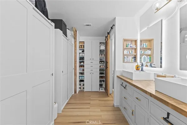 a spacious bathroom with a shower and a sink