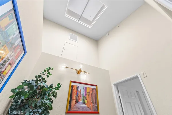 a view of a hallway with paintings on the wall