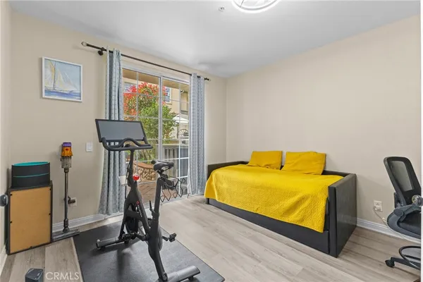 a bed room with a bed and a window