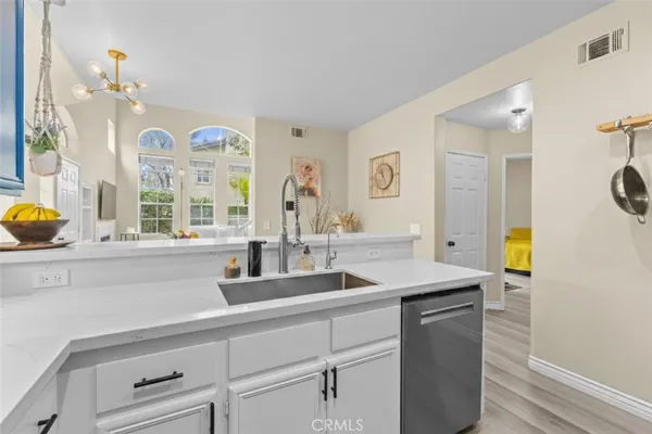 a kitchen with a sink and a window
