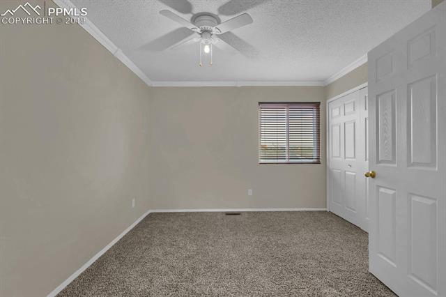 4415 Fencer Road Colorado Springs, CO 80911 - Photo 22 of 27 Secondary bedroom upstairs-attached to flex room