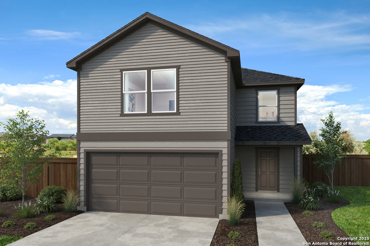 5230 Big Oak Run Elmendorf, TX 78112 - Photo 1 of 1 a front view of a house with a garage